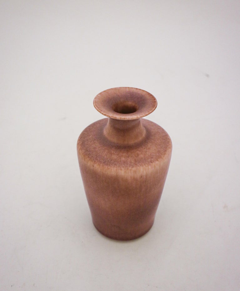 A vase in a light purple-tone designed by Gunnar Nylund at Rörstrand, it is 14.5 cm (5.8