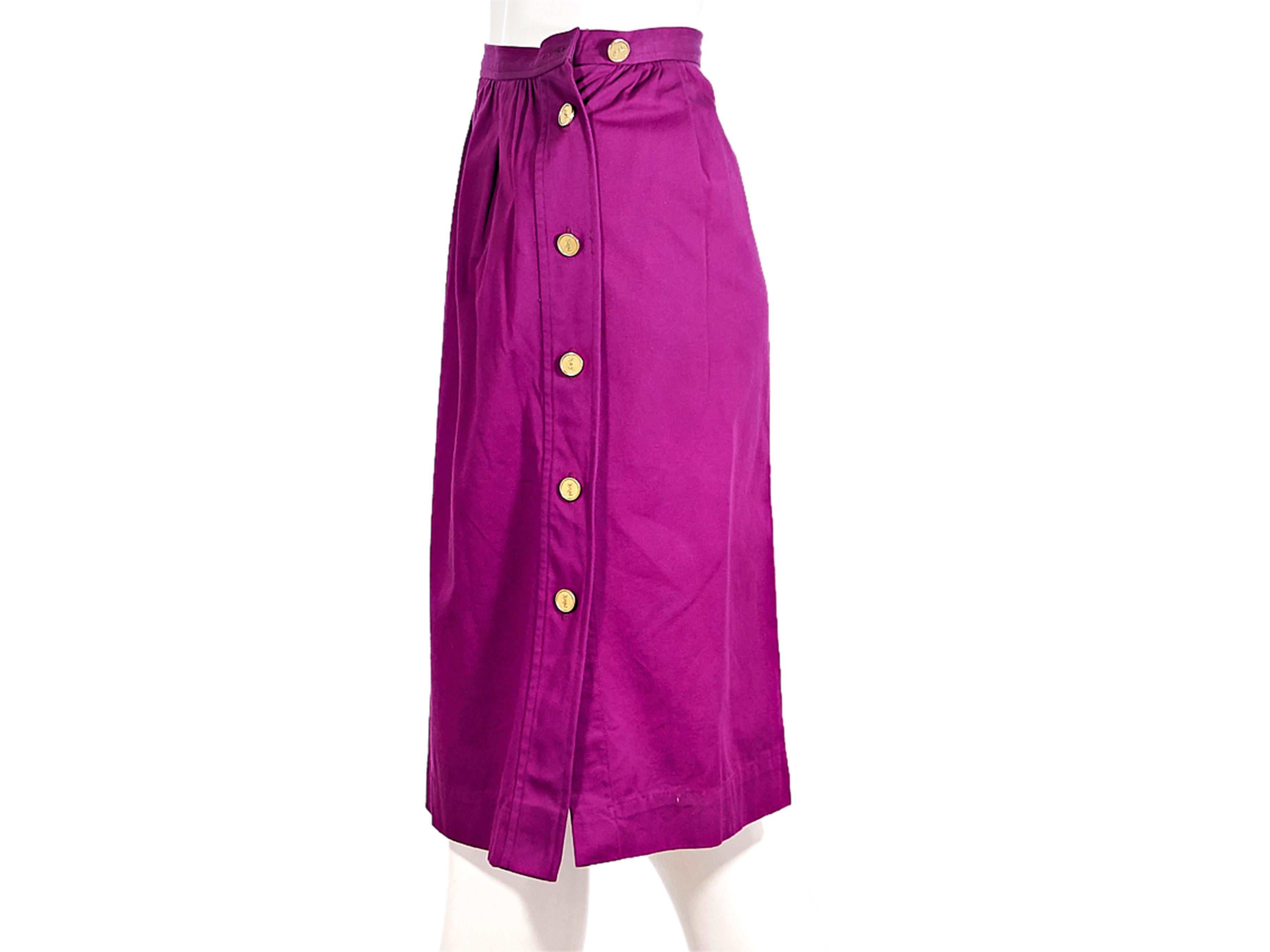 Product details:  Vintage purple high-waist skirt by Yves Saint Laurent. Knee-length. Gold-tone logo embossed button side closures. Style yours with a floral-patterned blazer. Label size FR 36. 25.5