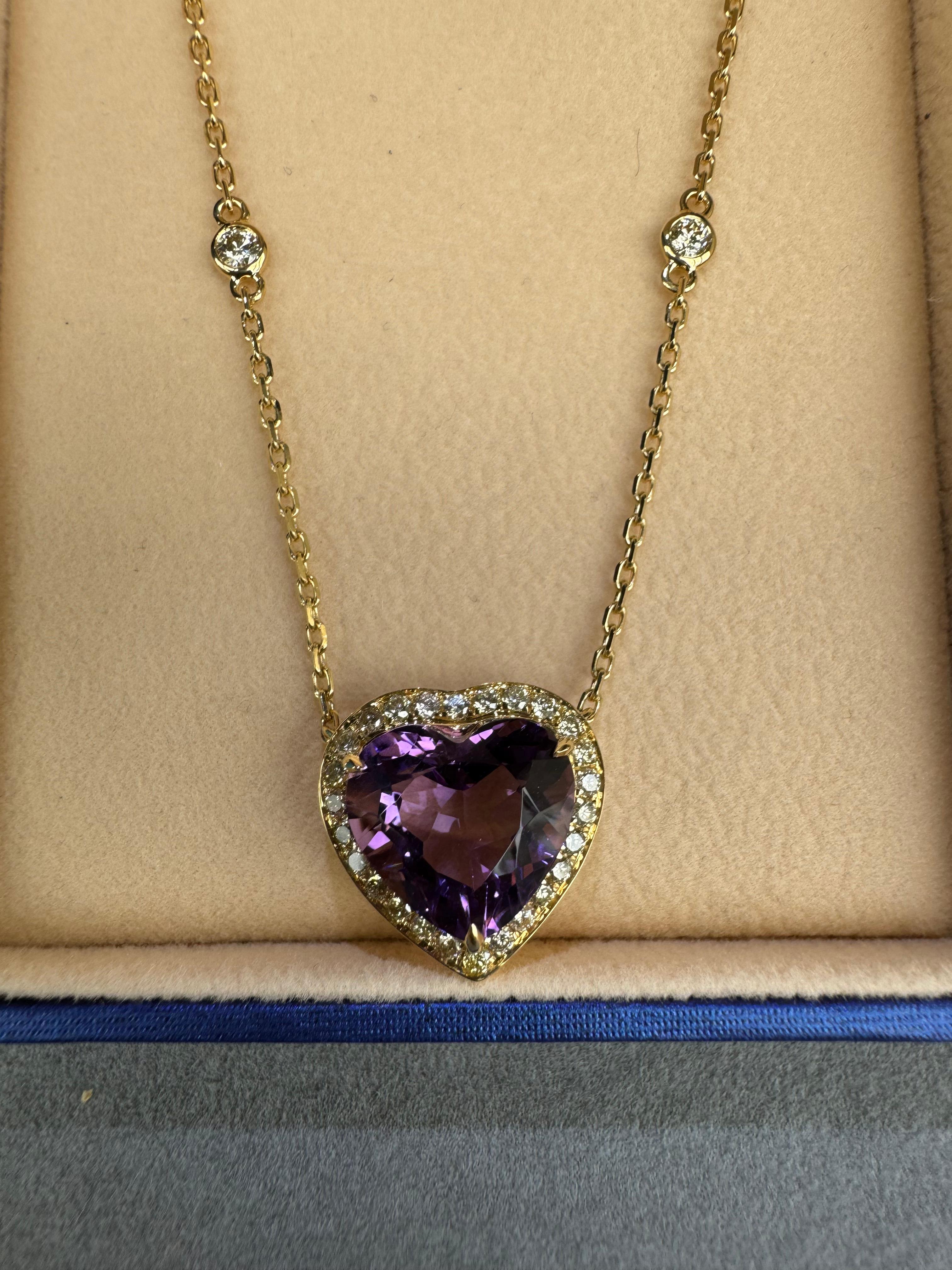 Embrace the refined beauty of this exquisite gemstone heart-shape pendant necklace.  Crafted with solid 18K gold and intricate detailing, the necklace features the highest-quality faceted diamond-cut chain that gracefully holds a natural brilliant