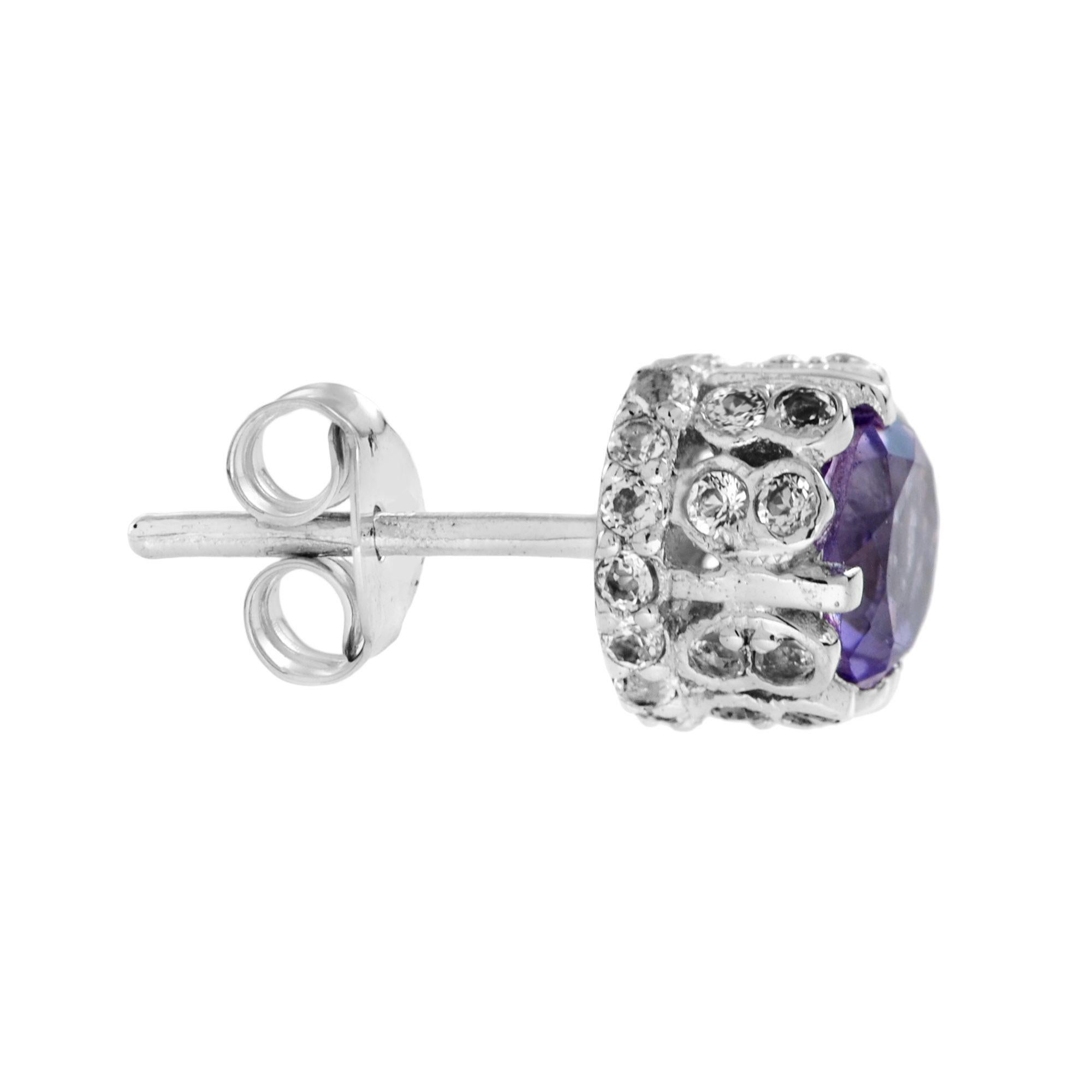 Simple, yet elegant, these earrings have an amethyst center stone with an enhanced design to add to the sparkle. Perfect for those casual occasions where you want to add a little bling. Or perfect to add an understated sparkle for a more formal