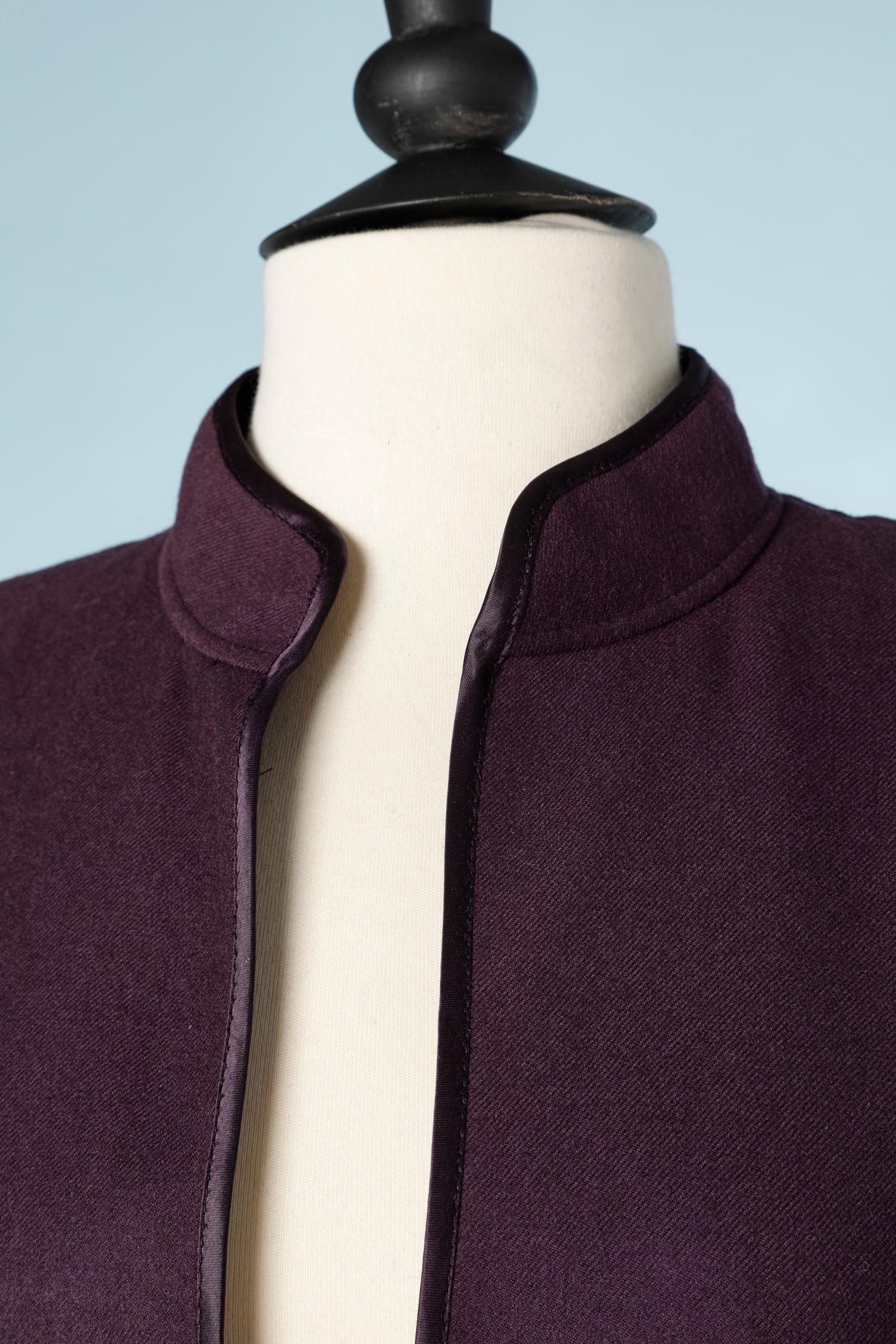 Purple wool skirt suit . No fabric composition tag but the lining is probably acetate or rayon. The lining is branded.
Thin shoulder pad. Piping inside the jacket. 
SIZE M 