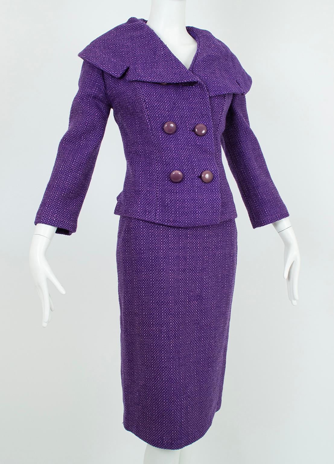 Regal in color, this extraordinary suit is made even more spectacular by its masterful construction, feminine silhouette and triumphant matching Inverness coat. Traffic-stopping without the coat, the suit features a dramatic shoulder-width portrait