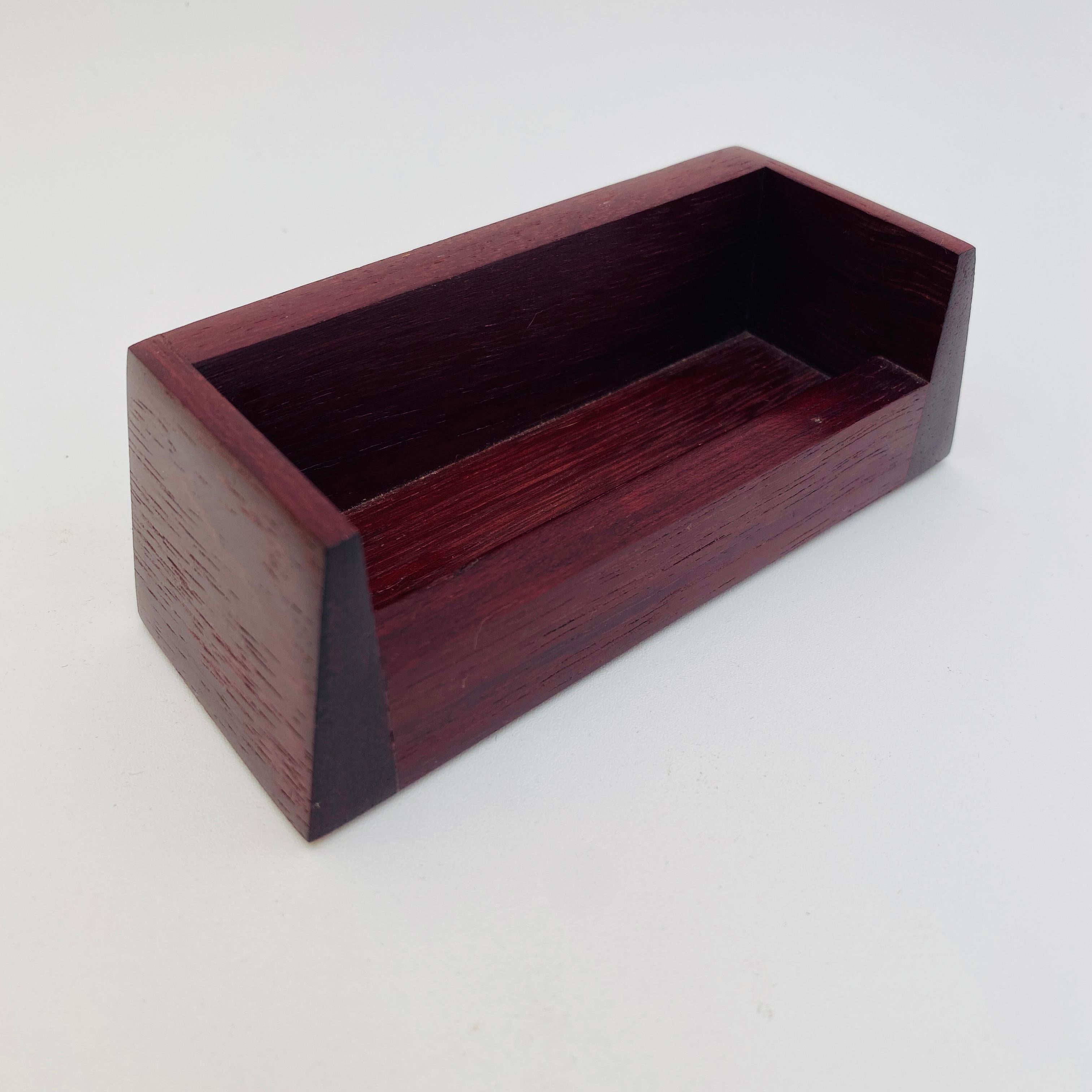 This purpleheart wood card holder has nice clean lines, perfect for an office or desk. The bottom is signed and dated with the inscription, 