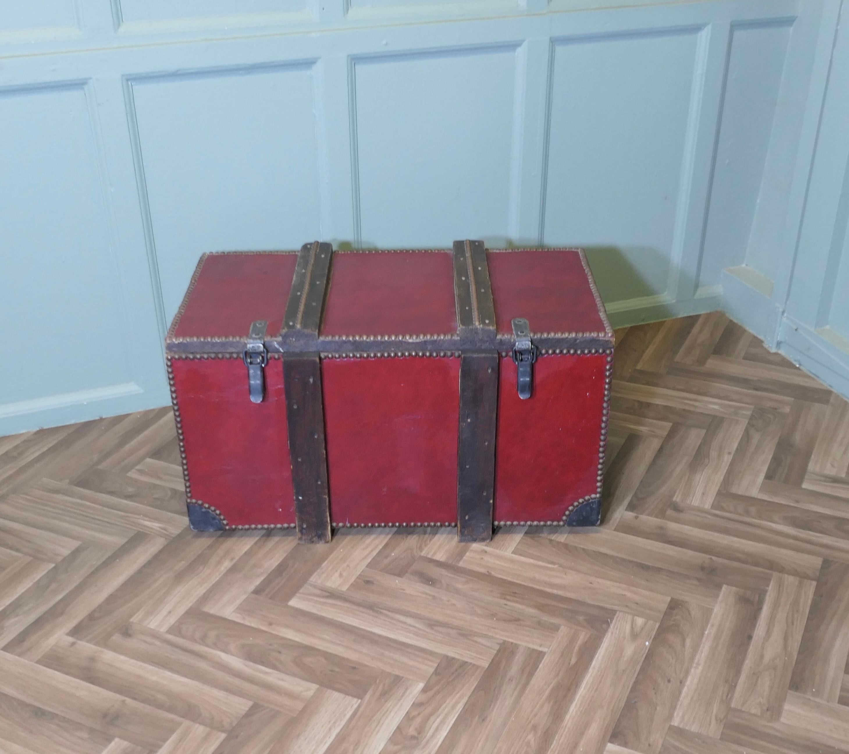 Purpose Made Leather Travel Trunk Strong Box

This piece was made to fit on a carriage, it is very heavy and strong, it is banded with wood and leather and has a covering of studded leather
This is a very heavy quality box, it has 2 strong clasps,