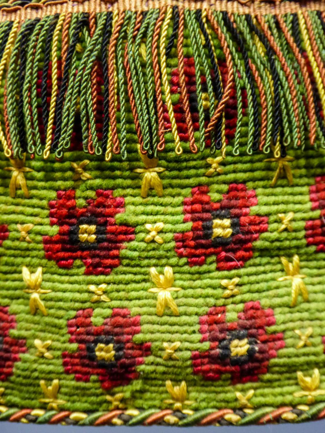 Circa 1860
France

Elegant petit point reticule or purse dating from the Second French Empire. Tapestry with petit point and large floral pattern on light green background, embroidered with yellow floss-silk. Cardboard base and lined with green
