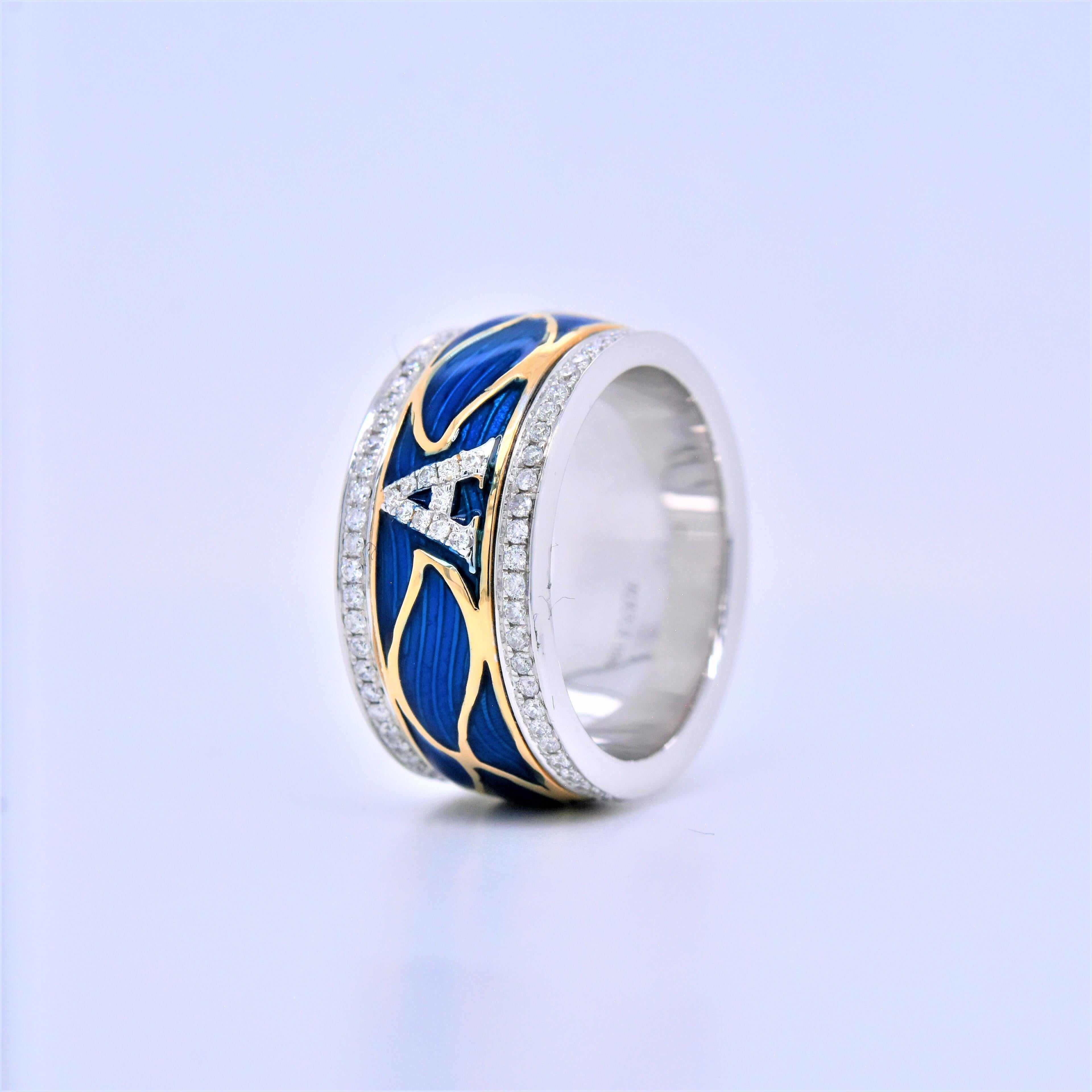 Trendy 18k White Gold Band with Blue Waves of Enamel and  Yellow Gold Detailing 
Total Carat Weight: 0.61 Carat
White Diamonds: 0.61 Carats (total 122 stones)
Metal: 15.95 grams, 18k White Gold 
