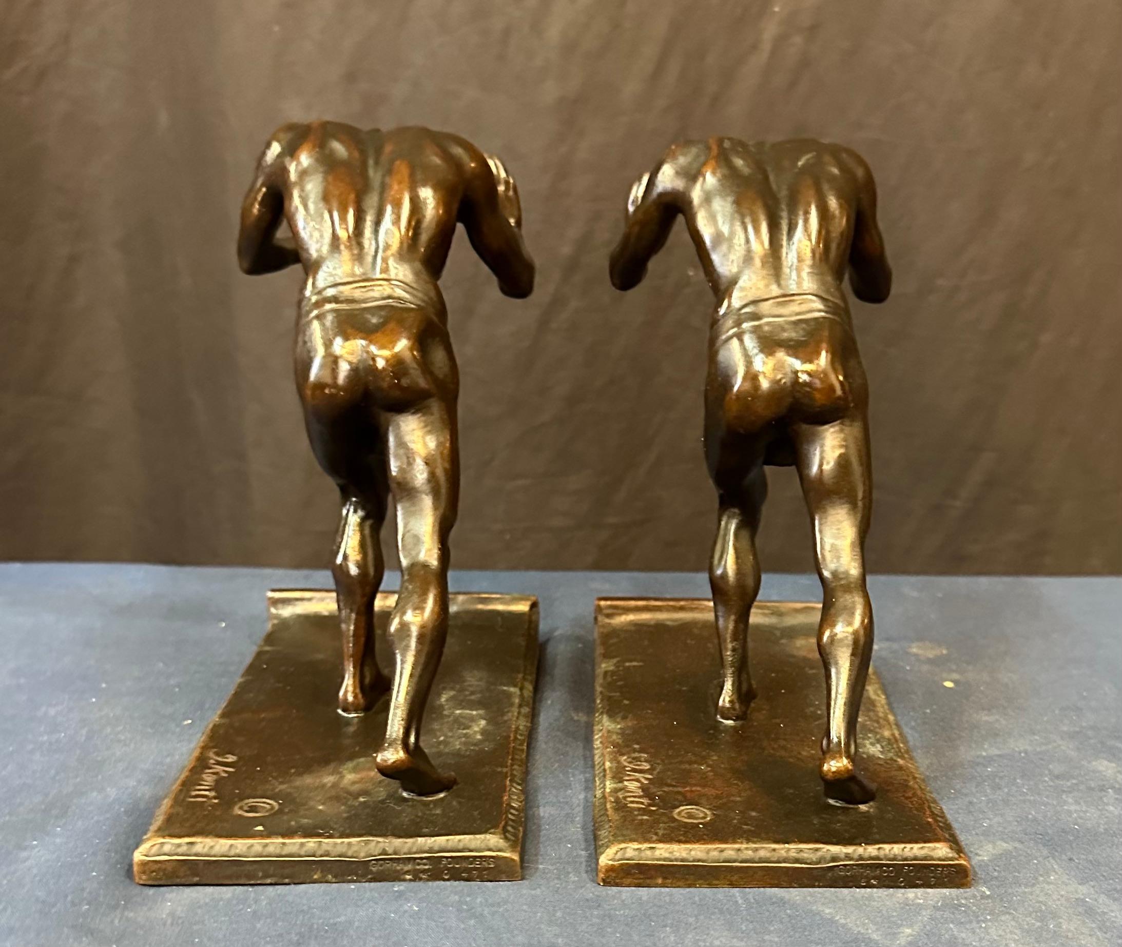 Art Deco Pushing Men, A Pair of Bookends For Sale