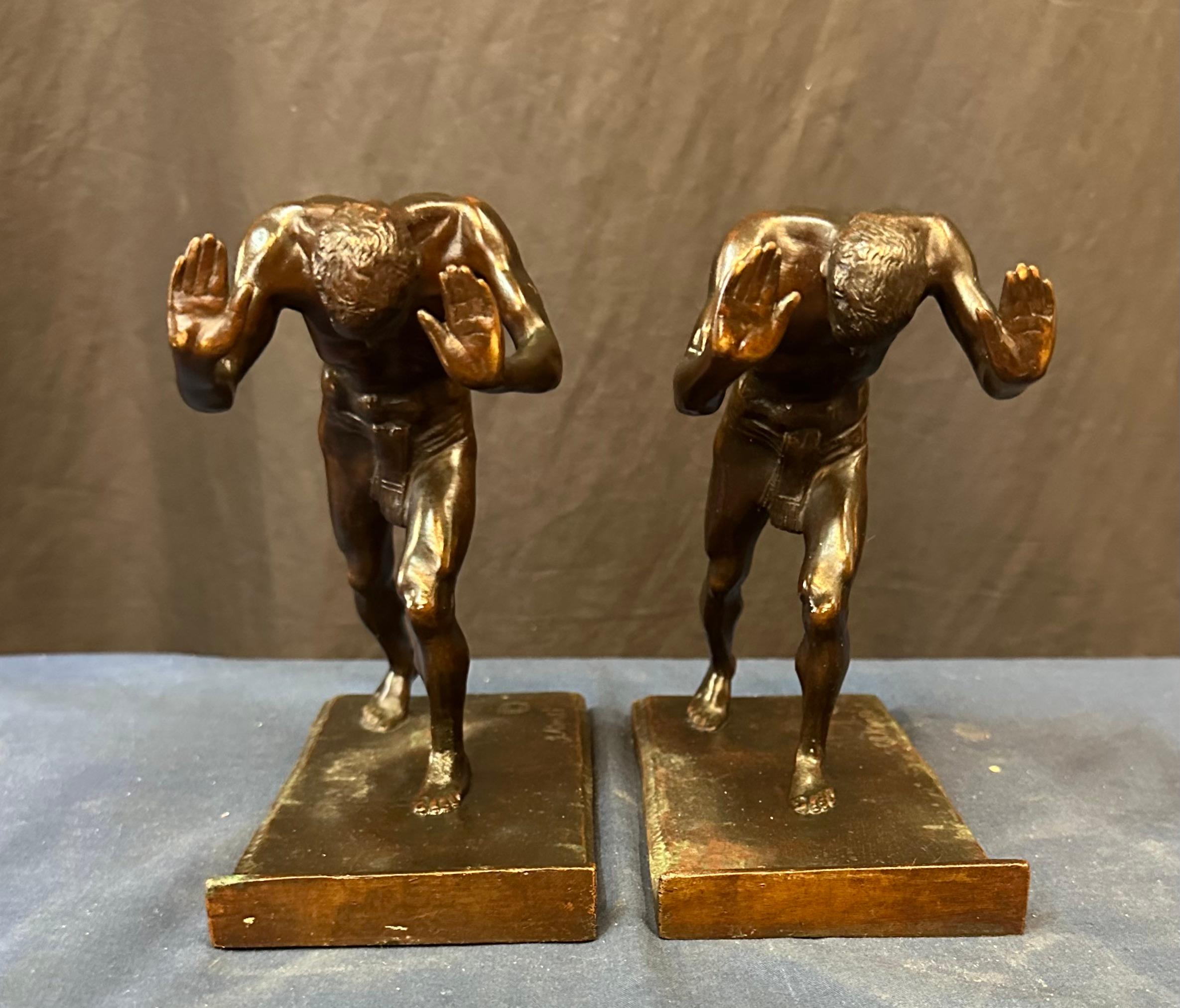 Austrian Pushing Men, A Pair of Bookends For Sale