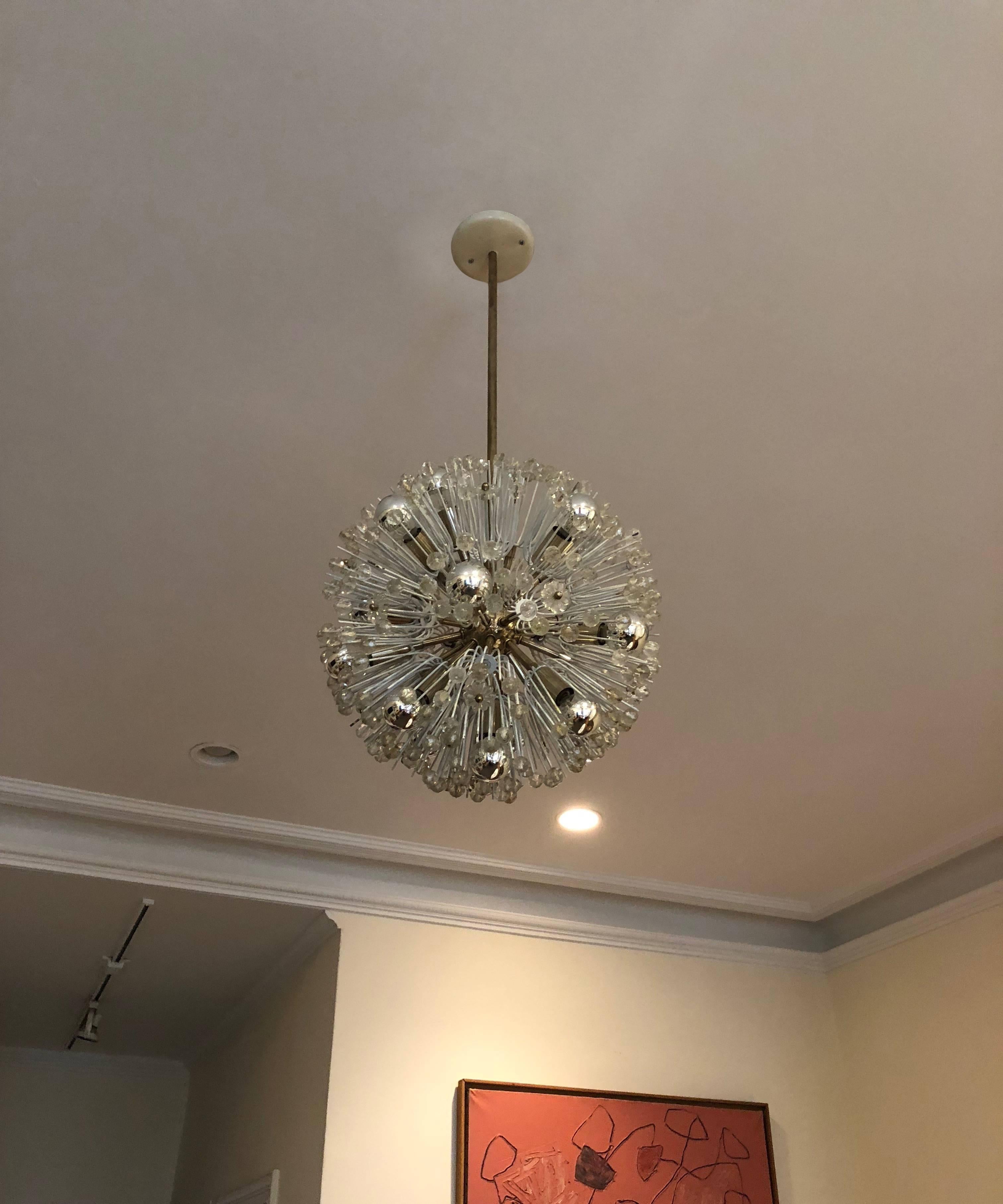 Pusteblume or spherical seed head shaped ceiling fixture designed by Emil Stejnar for Robert Nikoll comprises a polished nickel plated frame, stem, and arms, and 17 lights. The arms serve as the visual base for the structural clusters decorated with