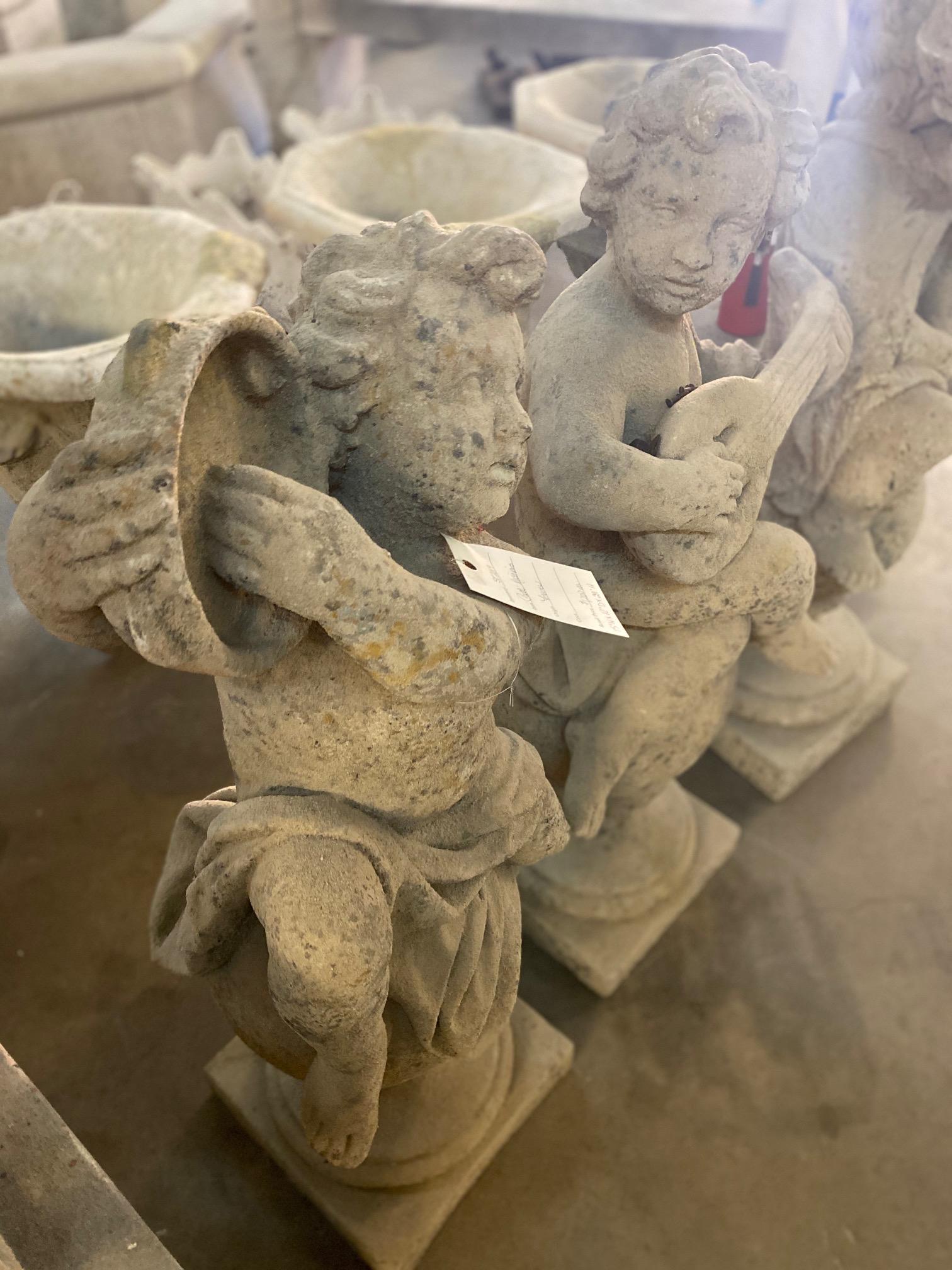 Here we have a lovely putti musician statue sitting on a ball, this design features a tambourine. 
Origin: France
Measurements: Approximate 39