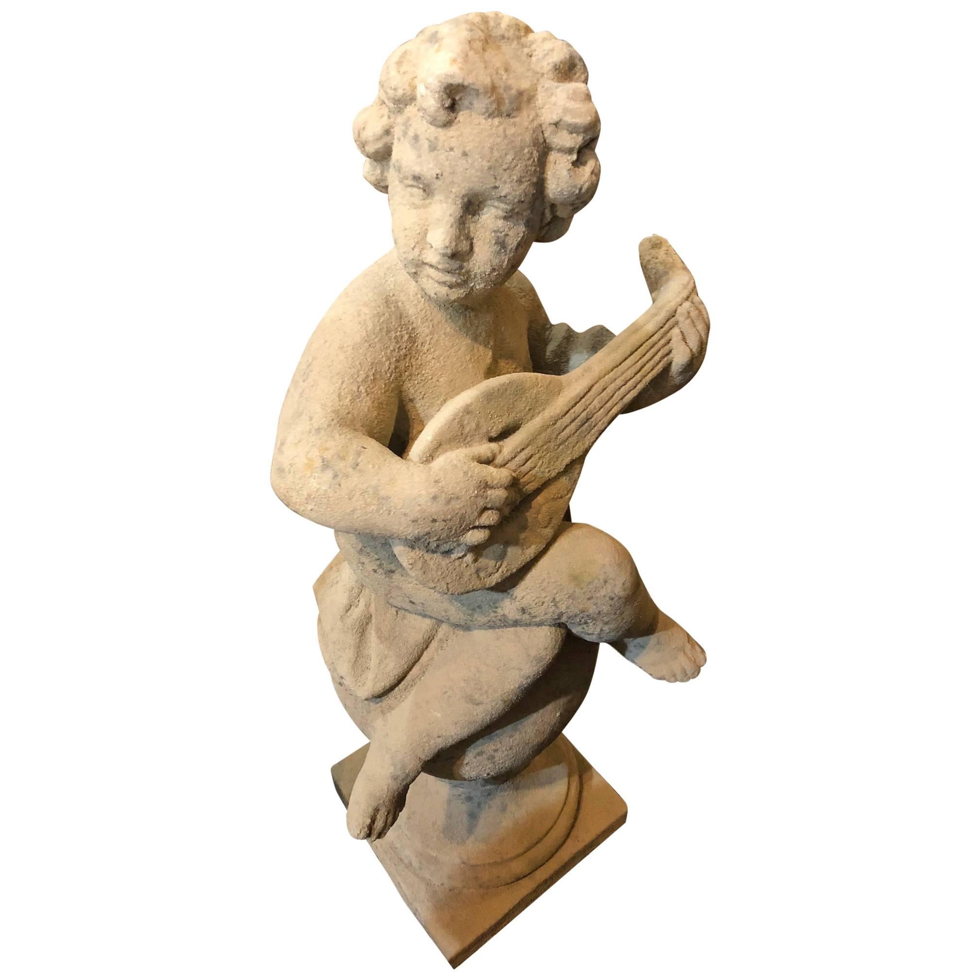 Statue de musicien Putti sur socle de boule