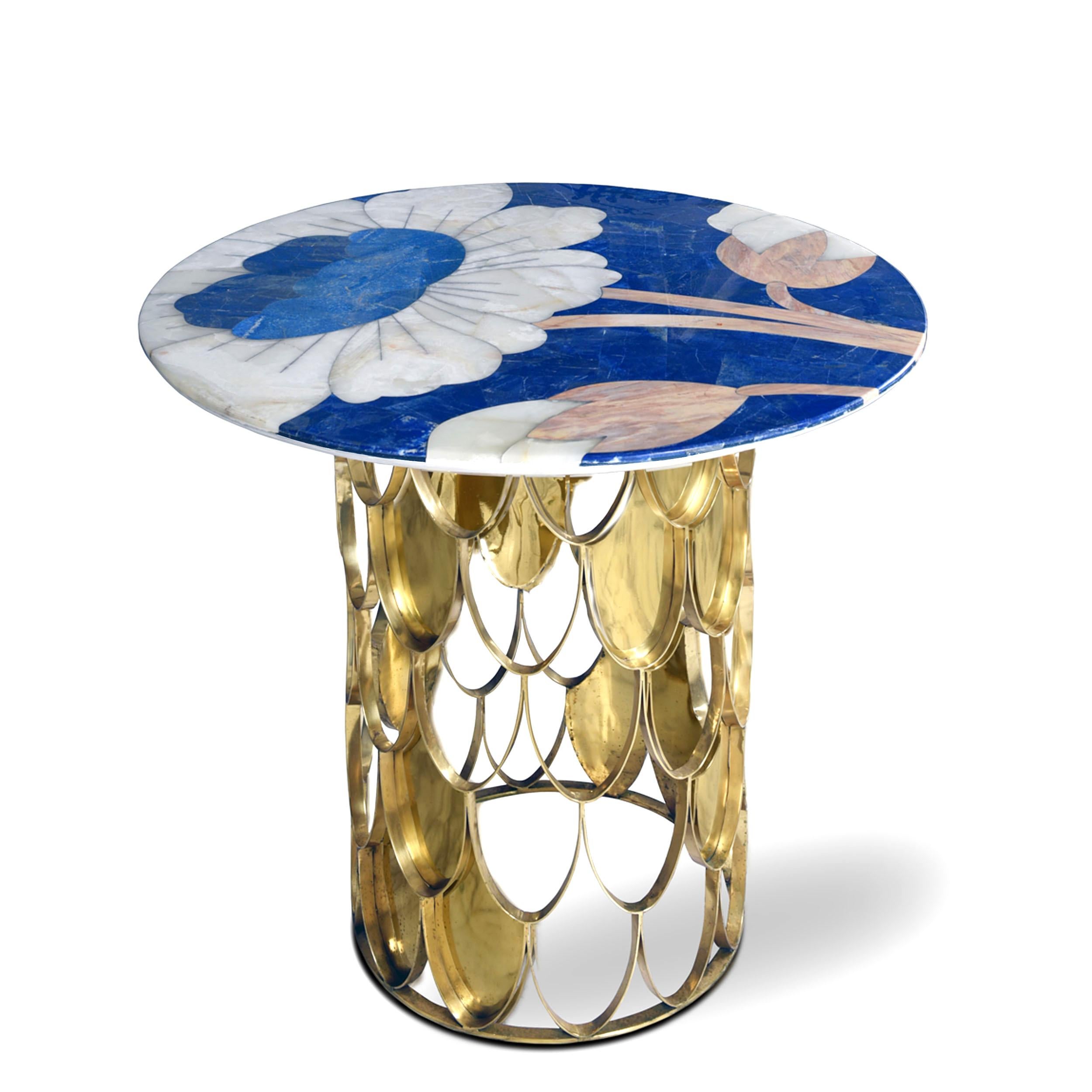 Puvvi foyer table by Studio Lel
Dimensions: D 91.5x H 91.5 x H 76 cm.
Materials: lapis lazuli, onyx, marble, brass.

From the Urdu word for the chrysanthemum flower, our Vogue-featuring Puvvi collection is a lively celebration of femininity. The