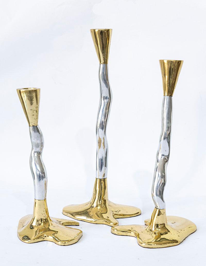 The decorative Candelabra was created by David Marshall, it is made of sand cast aluminum and sand cast brass. 
Beautiful piece to Decorated your Home, makes a beautiful Wedding Gift.
Handmade, mounted and finished in our foundry and workshop in