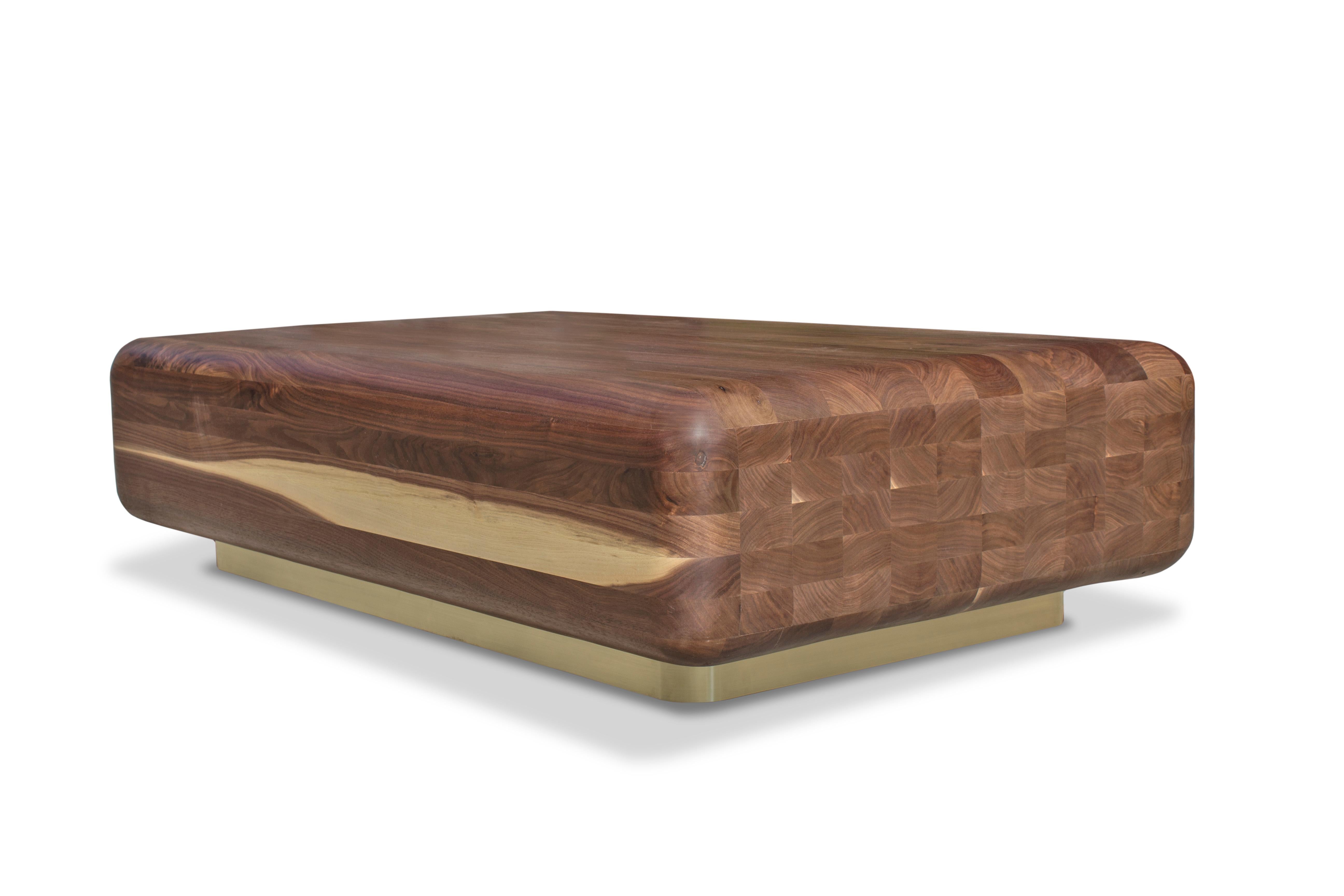 The daisy coffee table is a timeless addition to the Mark Jupiter carved collection. Originally designed for his daughter when she was first learning to walk, this elegant piece is made from hundreds of pieces of solid walnut hand carved into this