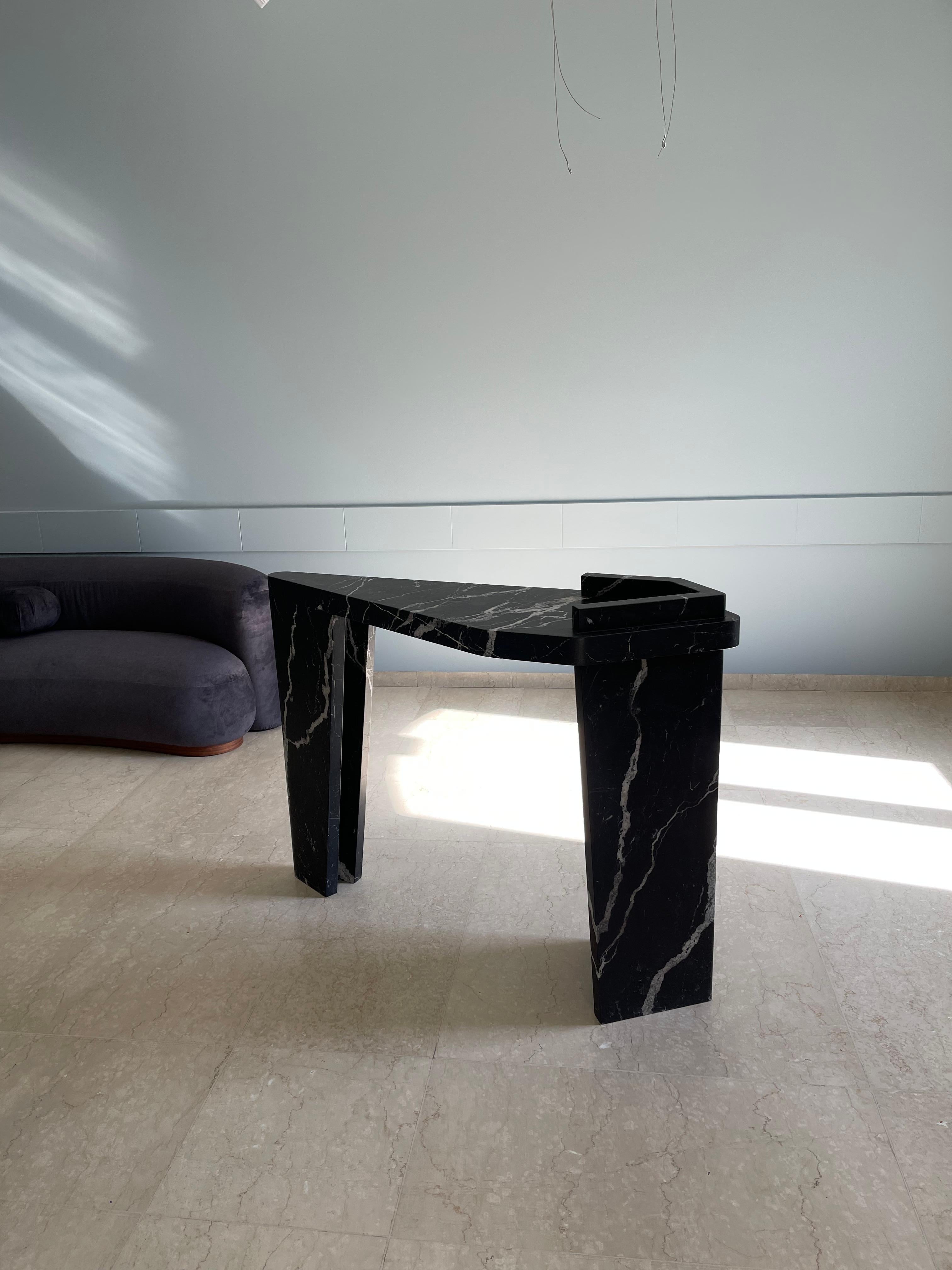 Puzzle Console Table Nero Marquina by Madina Tsarikaeva
Dimensions: W 130 x D 97 x H 42 cm. 
Materials: Nero Marquina Marble.

Madina Tsarikaeva (1994)
 
From early childhood, Madina began to show interest in art, spending a lot of time in the