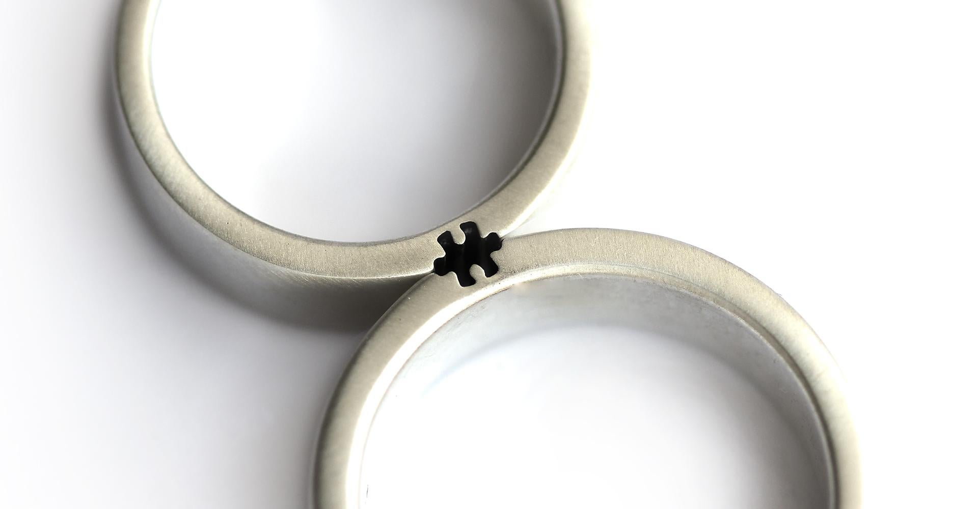 For Sale:  Puzzle matching couple rings set in Sterling silver