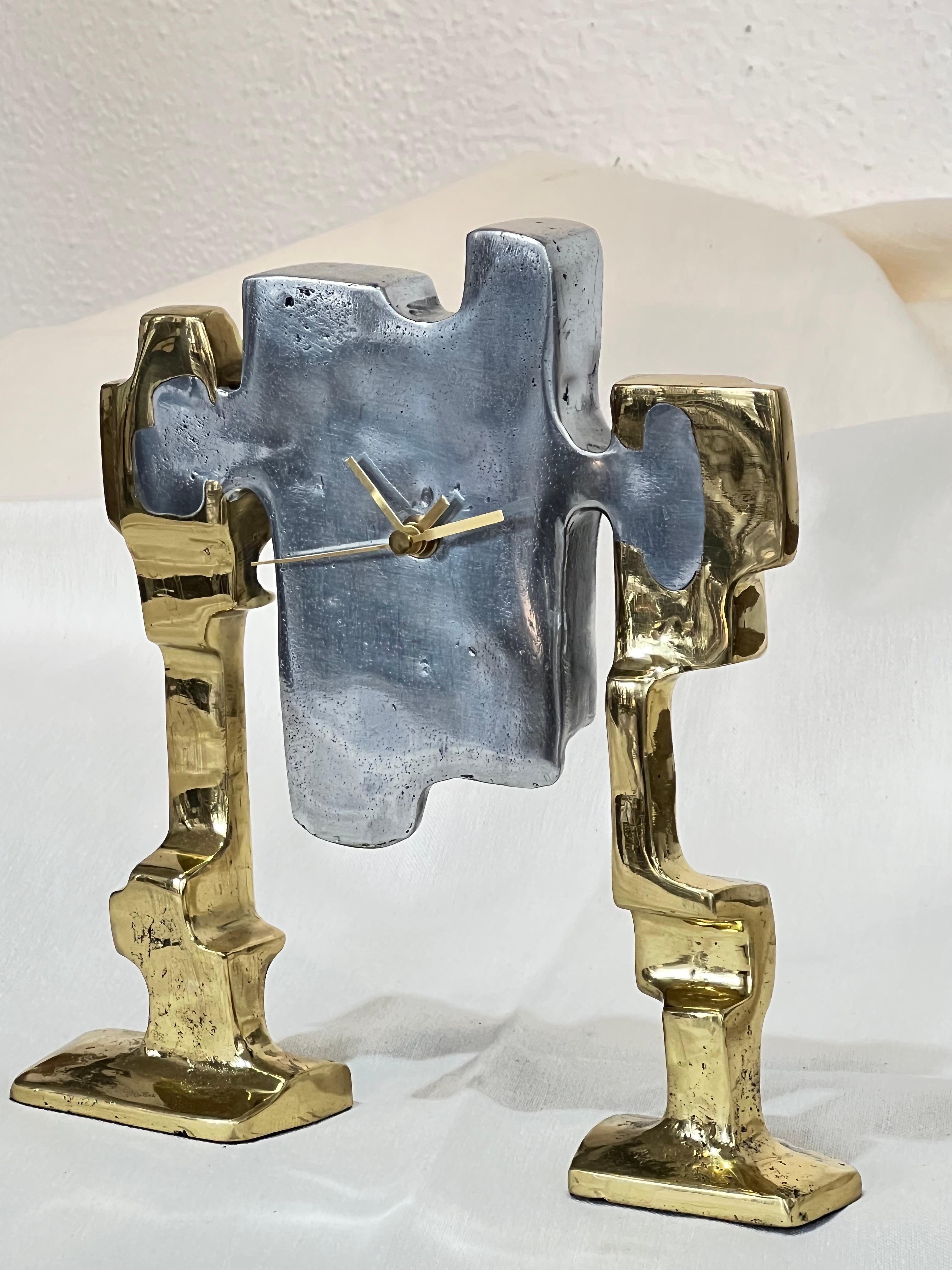 The decorative Table Clock was created by David Marshall, it is made of sand cast aluminum and sand cast brass.
Handmade, mounted and finished in our foundry and workshop in Spain from recycled materials.
Certified authentic by the Artist David
