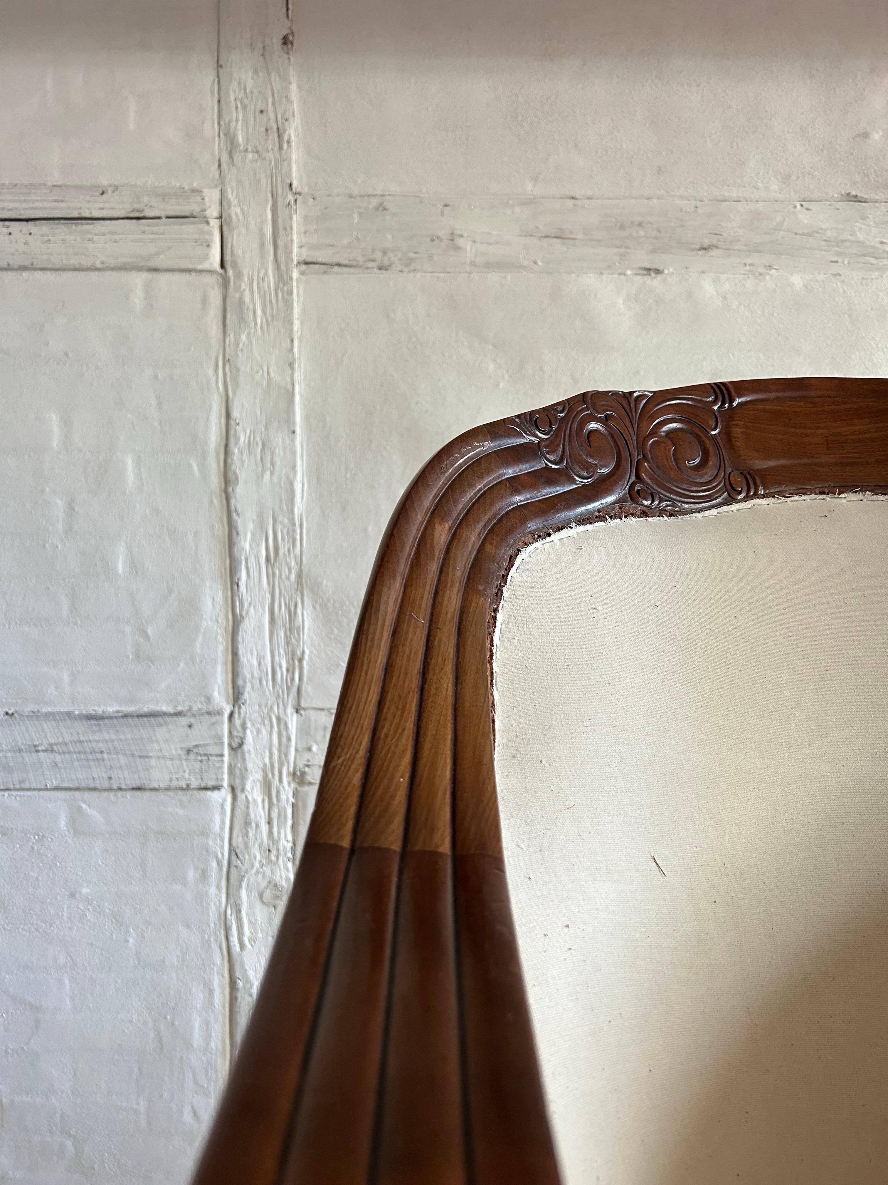 Exceptional and historically significant lounge chair designed by Peder Vilhelm Jensen-Klint (1853–1930), crafted in mahogany and featuring its original brass casters on the front legs. This piece was created for the Landsudstilling (National