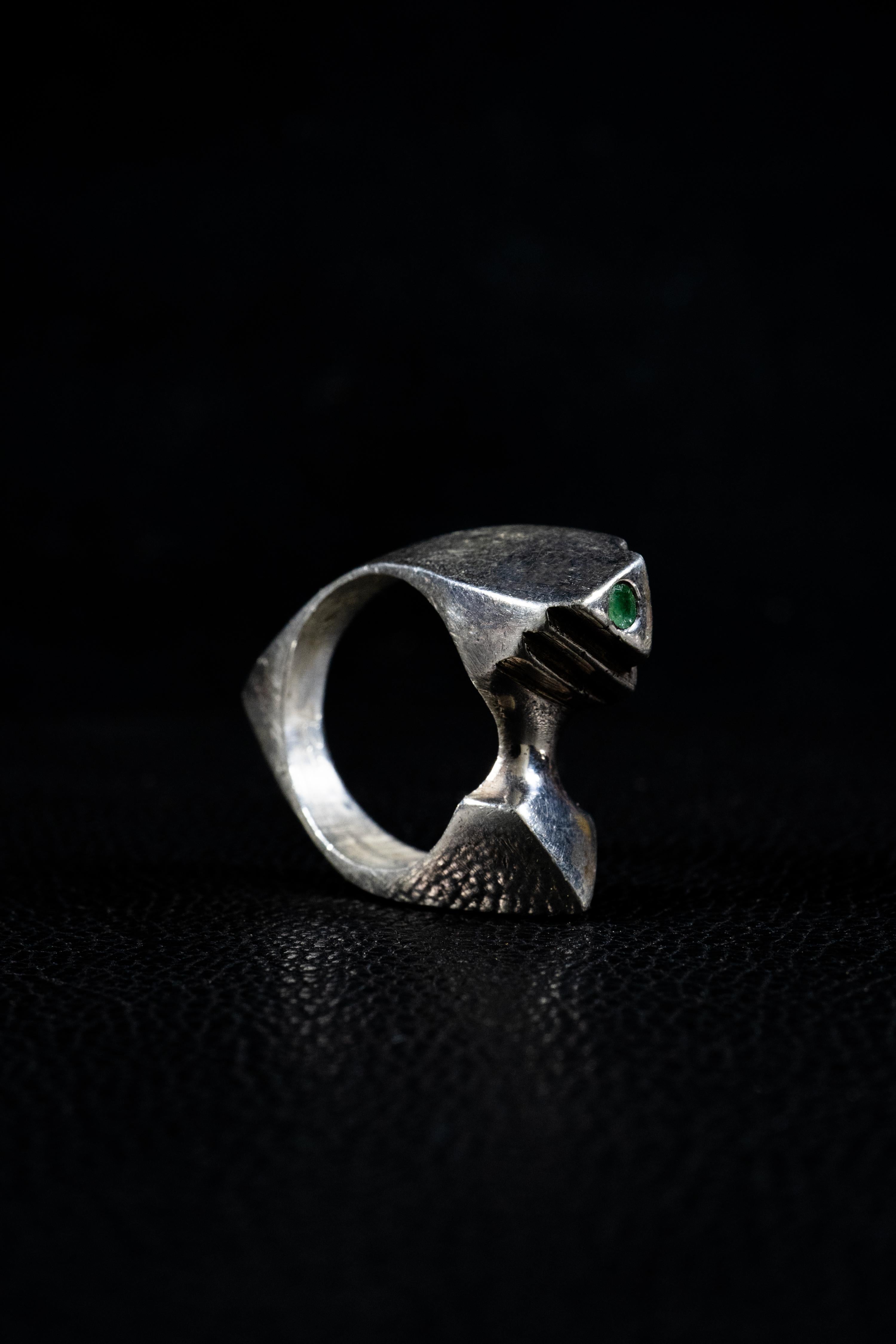 Pyramid is a handcrafted ring by Ken Fury that is hand-carved and cast. The ring showcases the intricate design of a pyramid that interconnects at multiple angles around the ring with a Genuine Emerald stone at the top.

Available in 10K Solid White