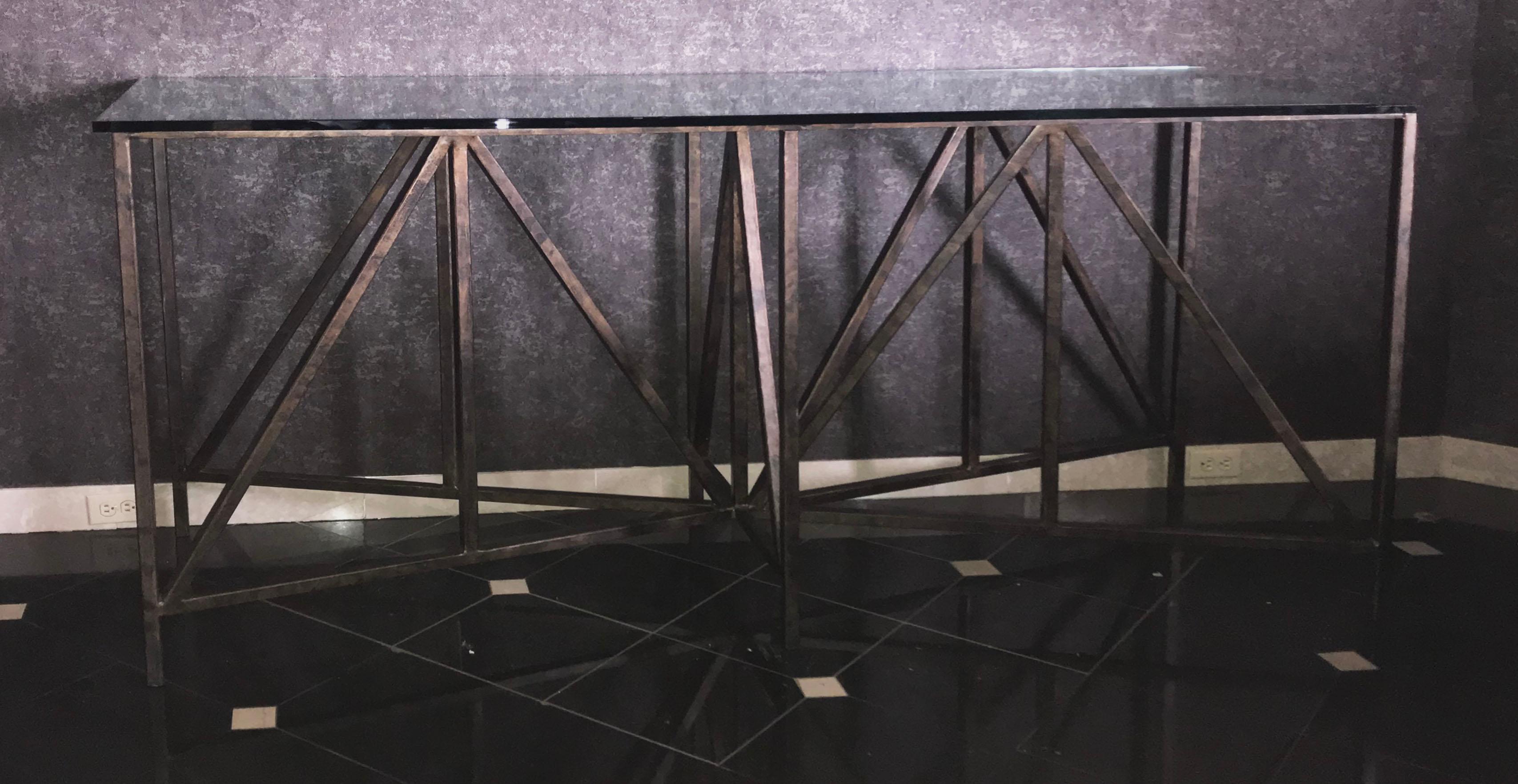 Featured in the 2015 Decorator's showcase house entry, this grand scale pyramid gilded bronze console table is a Candace Barnes Now original design with hand forged, triangular, multi-dimensional iron base. Finished in hand rubbed 22-karat gold and