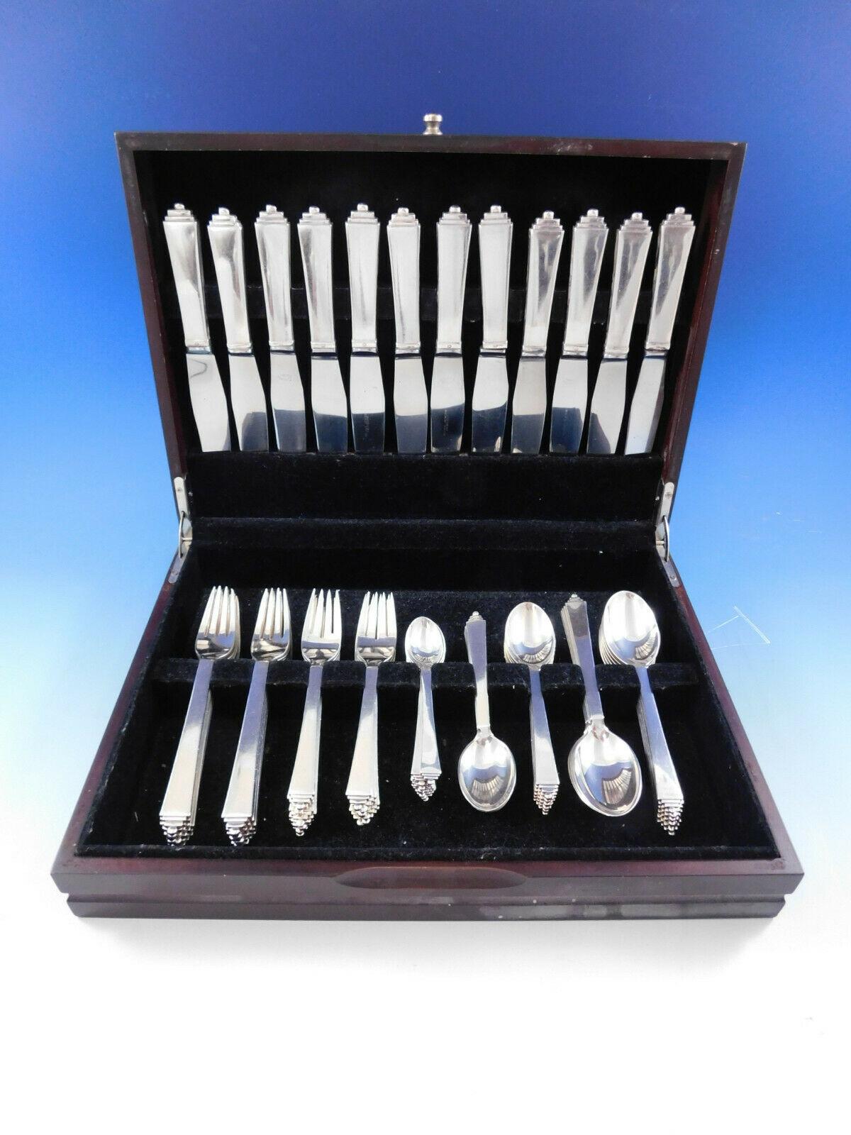 Dinner size pyramid by Georg Jensen Danish sterling silver flatware set - 72 pieces. This set includes:

112 dinner knives, 8 7/8