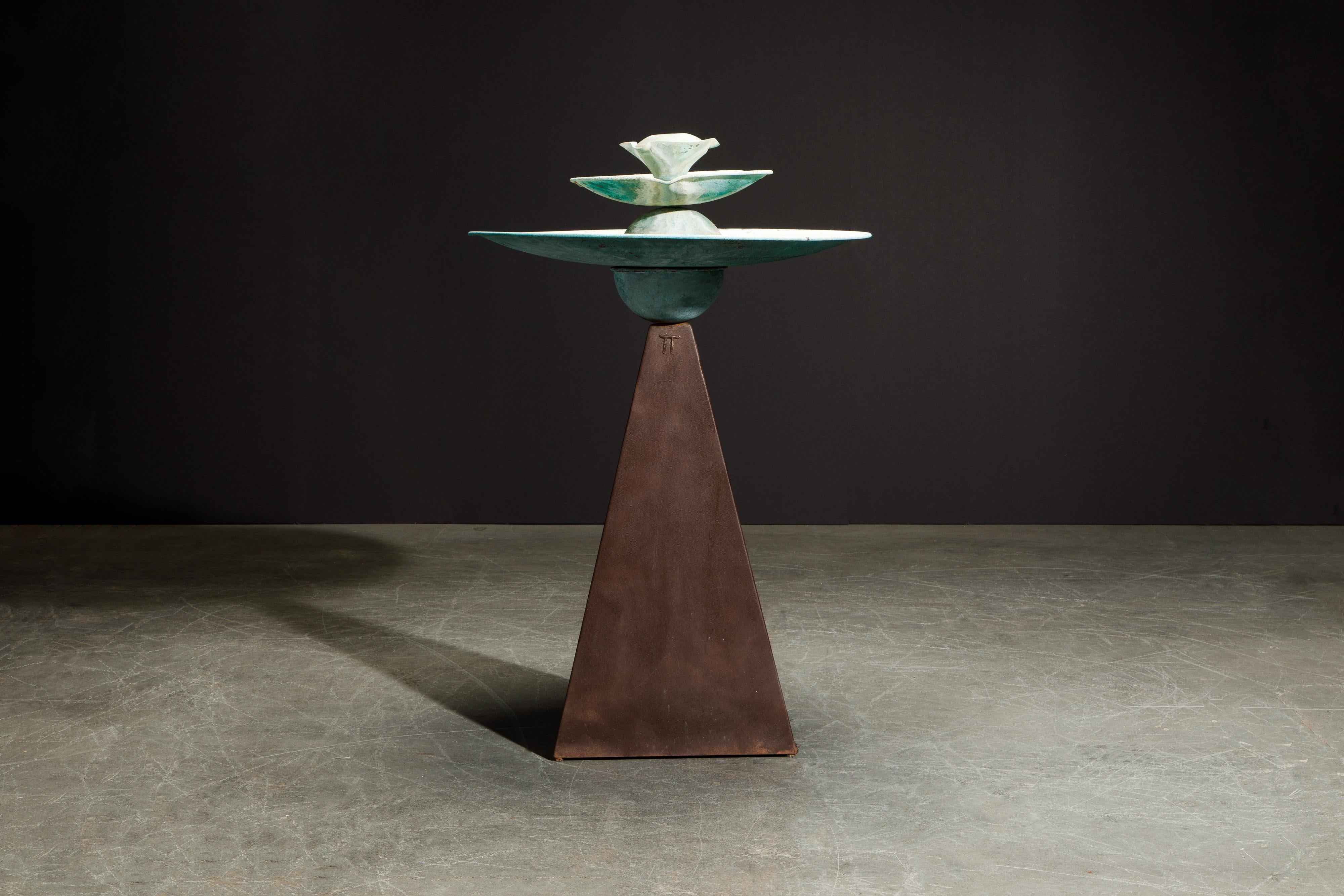This patinated copper and steel sculpture is called the 'Pyramid' Triple Fountain by renown artist and sculptor Tom Torrens, circa 1990s. Featuring a patinated verdigris copper fountain on top of a pyramid shaped weathered steel base, the original