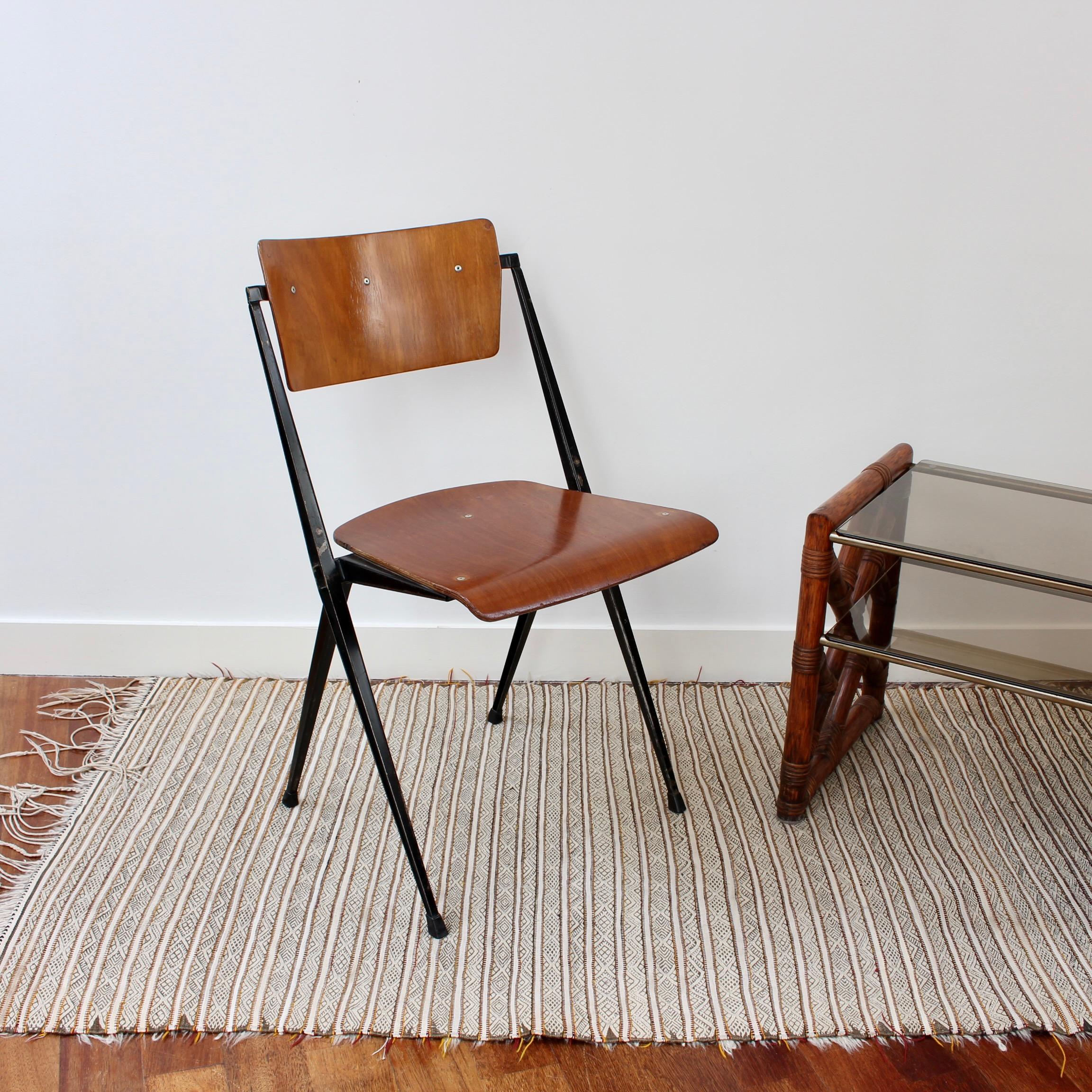 Wim Rietveld Pyramid Chair (1984). Designed in the 1960s (this chair has a date stamp on the underside 25 Nov 1984), by Dutchman, Wim Rietveld, his Pyramid chairs were produced by Ahrend de Cirkel. The wooden seat and back is supported by metal legs