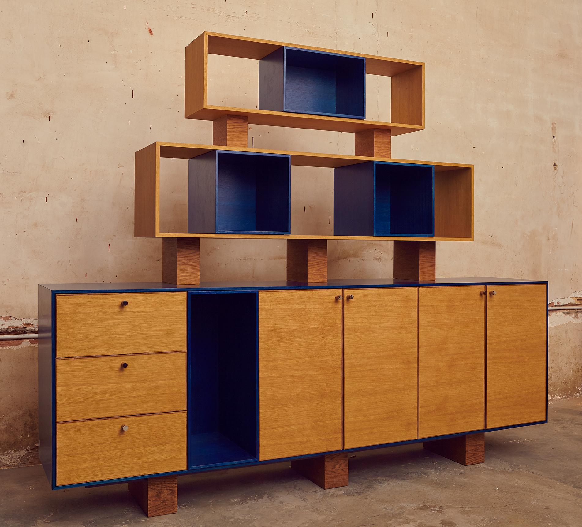 This Italian designed contemporary pyramid wall unit is hand finished in oak. This magnificent freestanding modular wall unit provides multiple storage configuration option. Shown here the unit was customized for a teenager's bedroom to provide