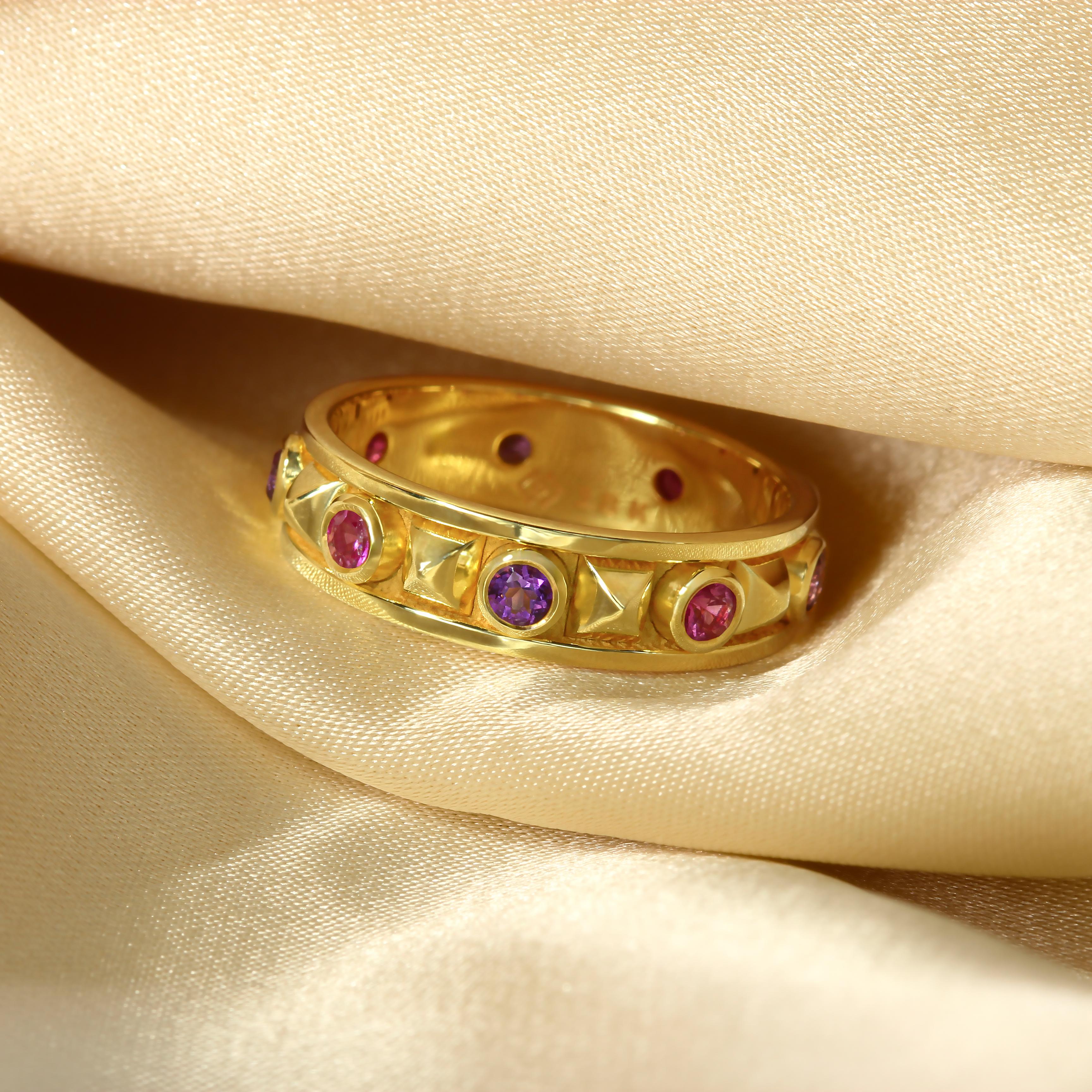 Indulge in the captivating allure of our pyramid gold ring, a mesmerizing blend of elegance and sophistication. This exquisite ring features a motif of alternating round amethysts and round pink sapphires, meticulously arranged in a captivating