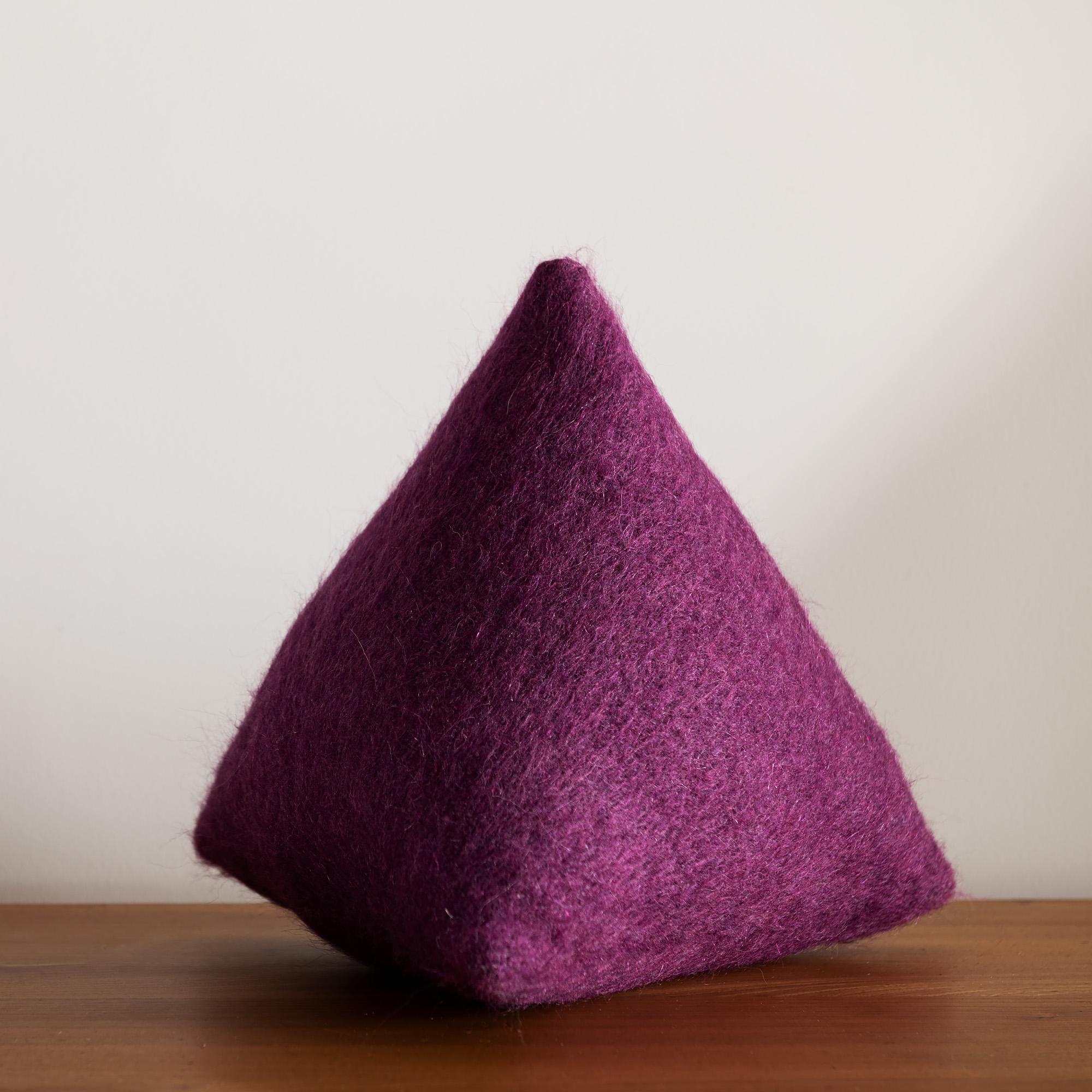 A gorgeous pyramid pillow, beautifully executed by our local seamstress in Pierre Frey Yeti Zinzolin. A hunt modern exclusive, this form will energize your living room or bedroom. Measures: 14