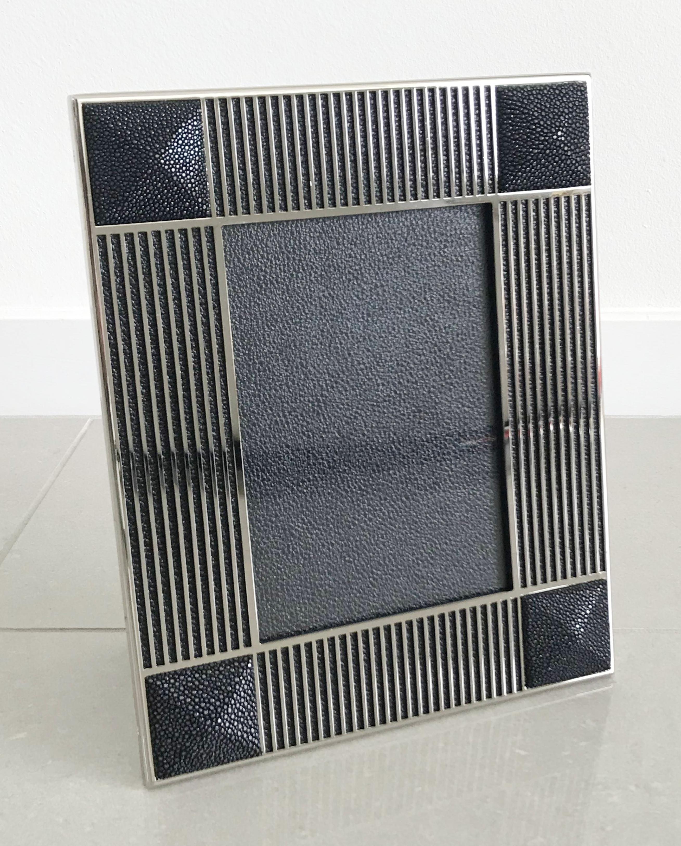 Black shagreen leather and nickel-plated picture frame by Fabio Ltd
Measures: Height 10.5 inches, width 8.5 inches, depth 1 inch
Photo size: 5 inches by 7 inches
1 in stock in Palm Springs currently ON 30% OFF SALE for $875 !!
Order Reference #: