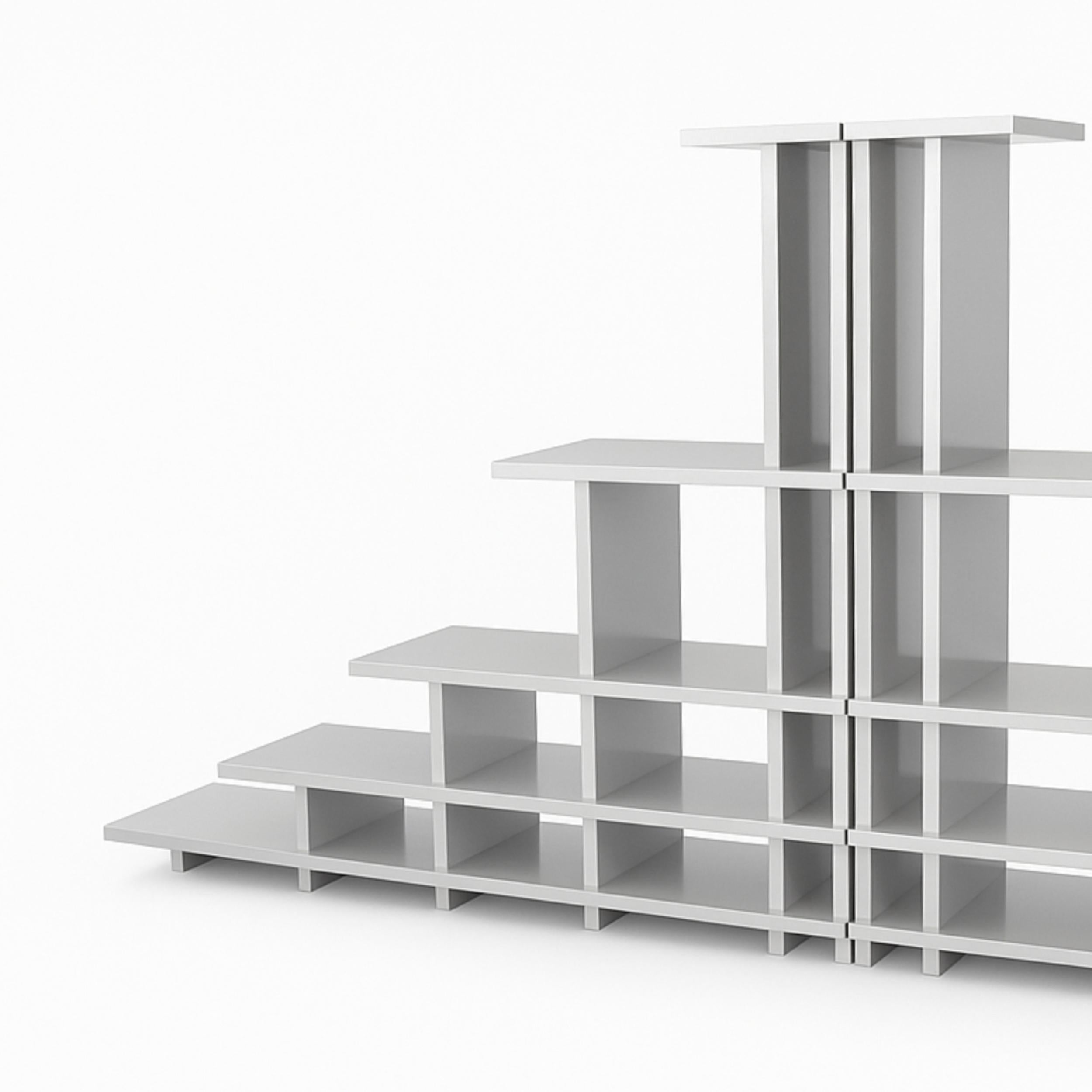 The Pyramid Shelf is made and designed by American furniture maker Greg Palombo. This monumental shelf is a contemporary reinterpretation of the ancient and ubiquitous pyramid form. We approached the piece with a mathematic division of space and the