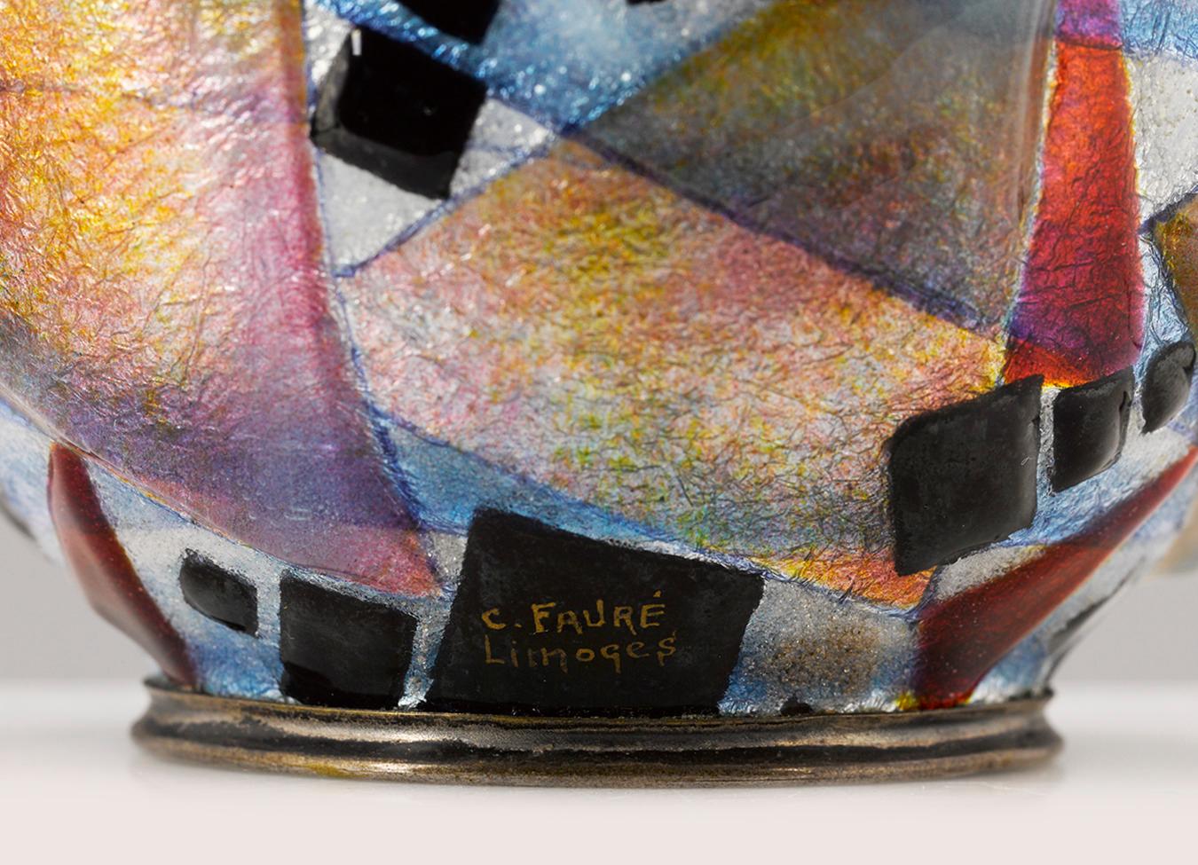 Geometric shapes in vibrant hues dance across the surface of this dynamic vase by the legendary Art Deco enameler, Camille Fauré. Fauré's revolutionary technique of applying layers of enamel in varying thickness across the vase's form gives it a