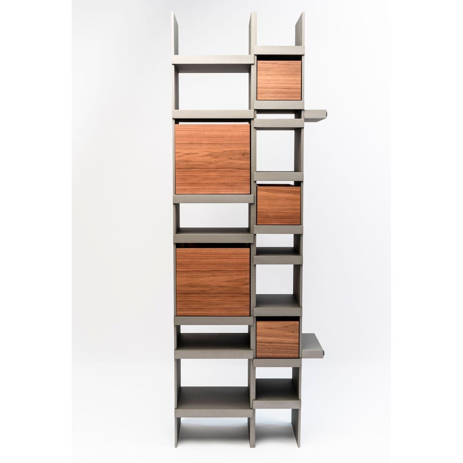 Pyrite Vertical bookshelf by Luca Nichetto
Materials: Drawers: Noce Canaletto solid wood, Leather
 Structure: Dark green NCS 8010 B70G/Coral NCS 2570 Y70R/Nero Ferro/ Light grey NCS 2002 
 Y50R/Peltro lacquered multilayer wood
Dimensions: W 59 x