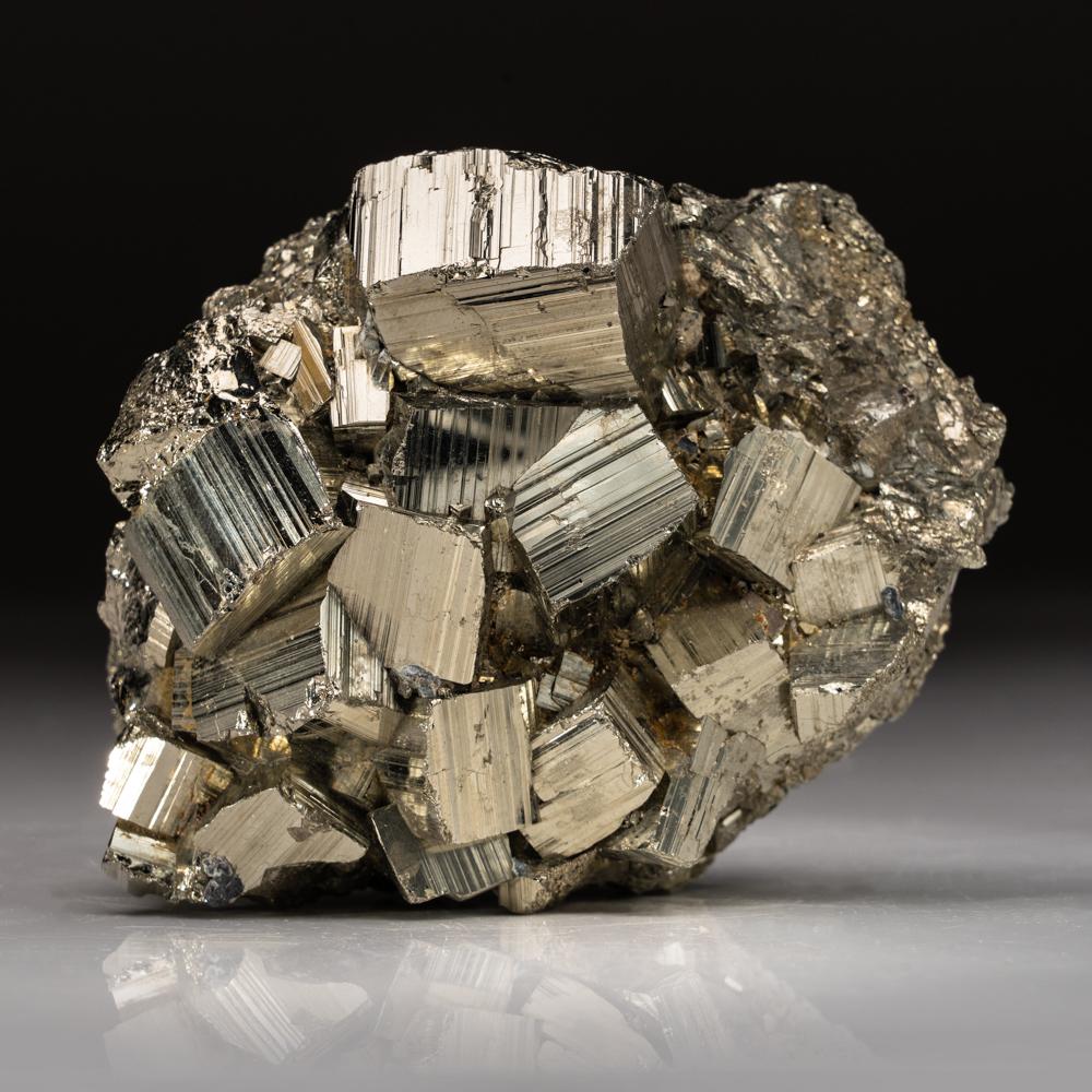 From Huanzala Mine, Huanuco Province, PeruA classic and very attractive specimen of rich golden Pyrite crystals in an intersecting complex cluster with sharp cubic formation and highly reflective metallic mirror luster faces with light striations.