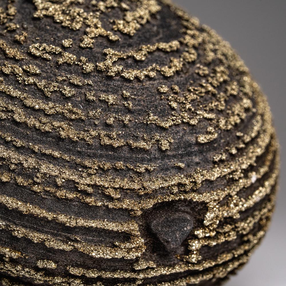 This unique Pyrite Concretion from Dongchuan District, Yunnan Province, China features sparkling, sharp, modified metallic crystals arranged in concentric 