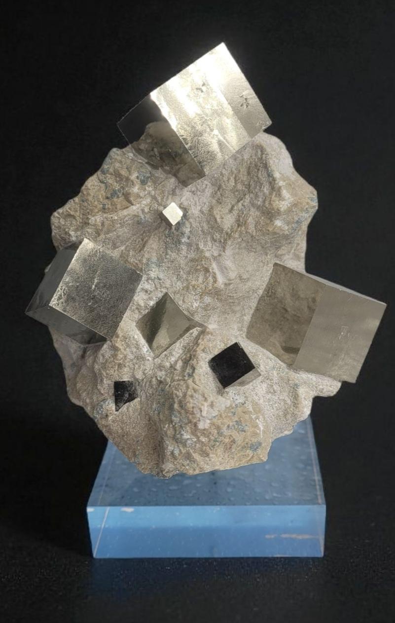 This Pyrite cluster on Matrix from Navajun in Spain, show the criterias of top best quality. The edges are intacts and sharp, the luster mirror like, and the compisition is naturally aesthetic.

It is mounted on an acrylic base to highlight the