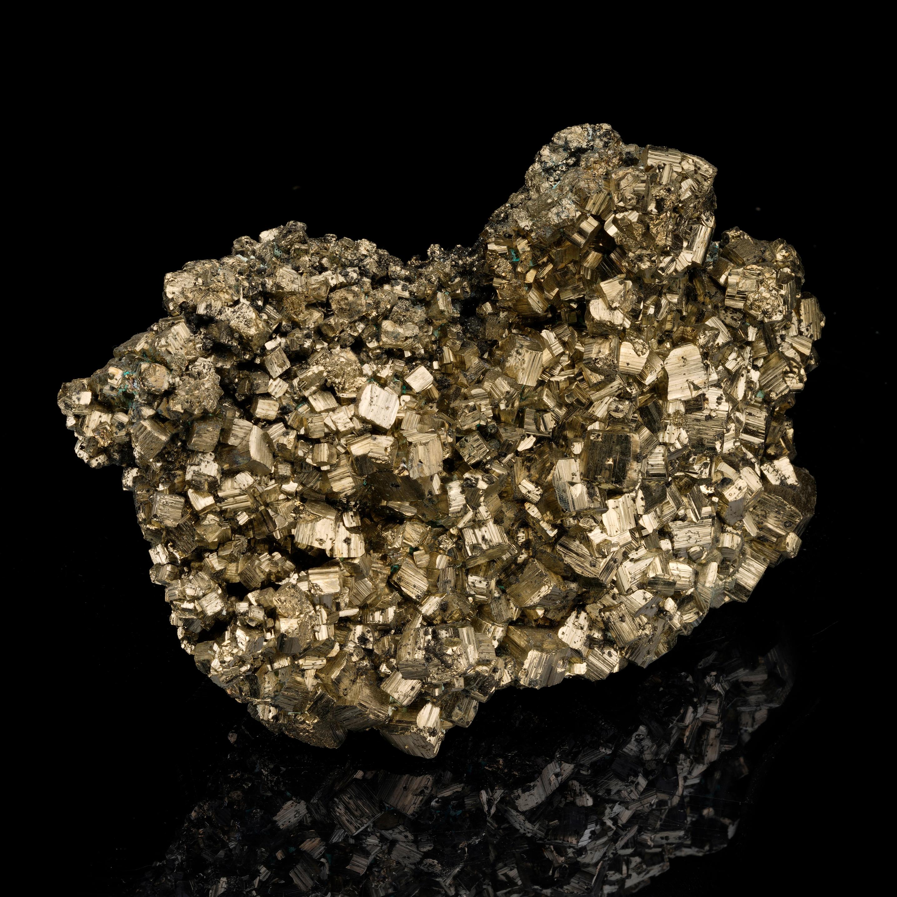 This sizable pyrite specimen features a bright, golden hue and mirror-like luster. Peru is known for its pyrite deposits and pieces from this location are coveted for their color and luster. With a plethora of beautiful, fully formed crystals, this
