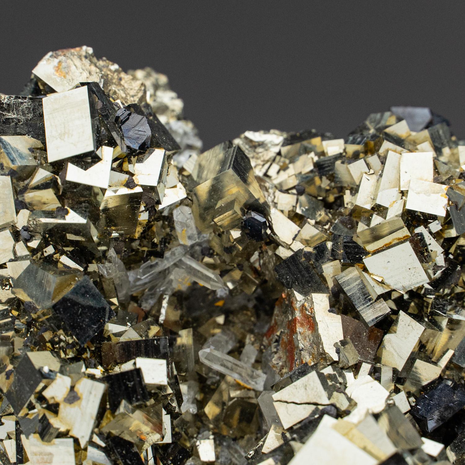 From Madan District, Rhodope Mountains, Bulgaria Sculptural formation of lustrous yellow-metallic pyrite crystals with Sphalerite. The pyrite crystals are cubic form with pyritohedral striations on the surfaces. The combination of the two minerals