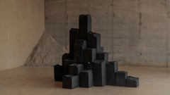 Pyrus Rock Pyramid Installation in Basalt & Stainless Steel by Andres Monnier