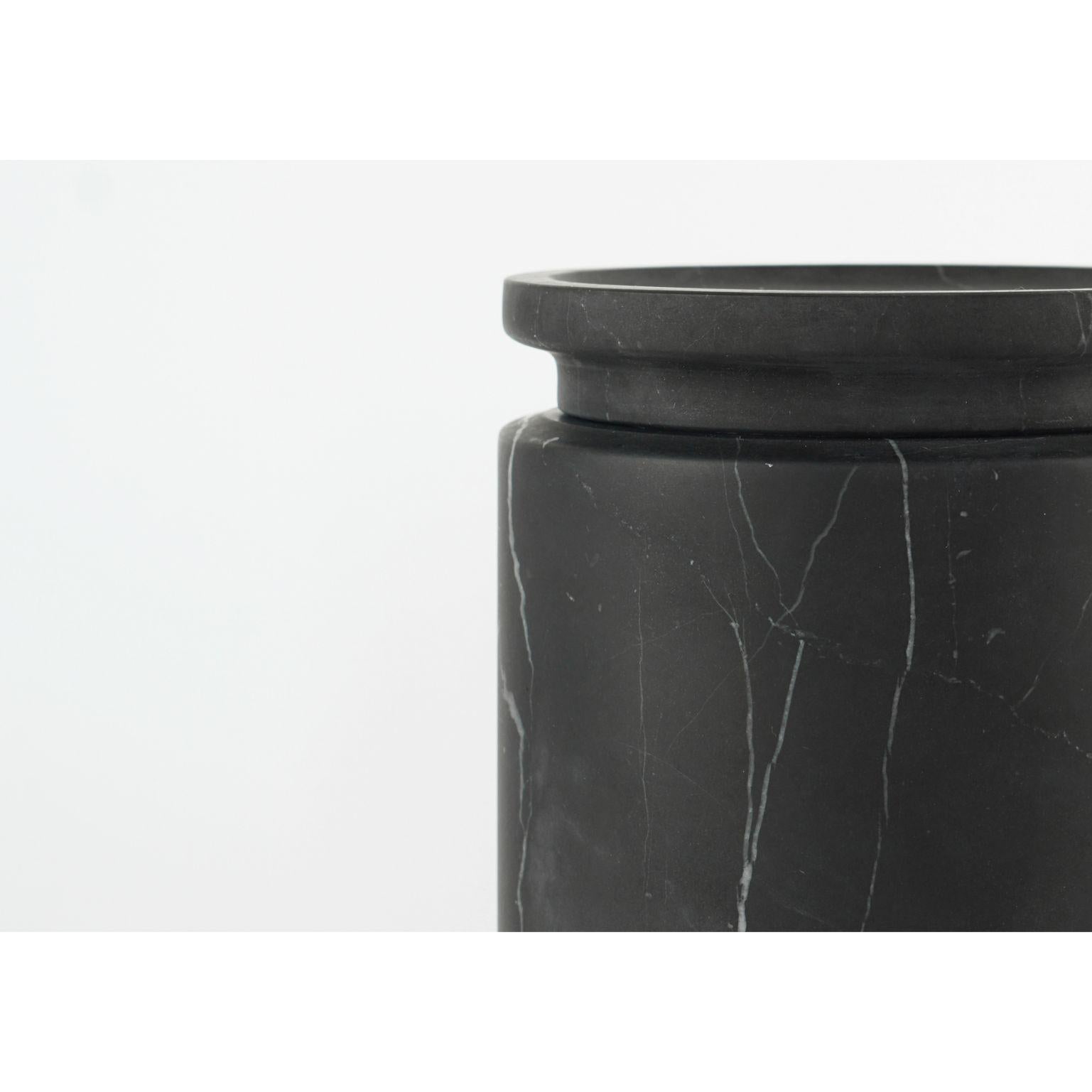 Pyxis - medium pot - black by Ivan Colominas
Pyxis Collection
Dimensions: 12.6 x 14.5 cm
Materials: Nero marquinia

Also available: Bianco michelangelo, small & large

A refined collection articulated through cylinders that vary only in size