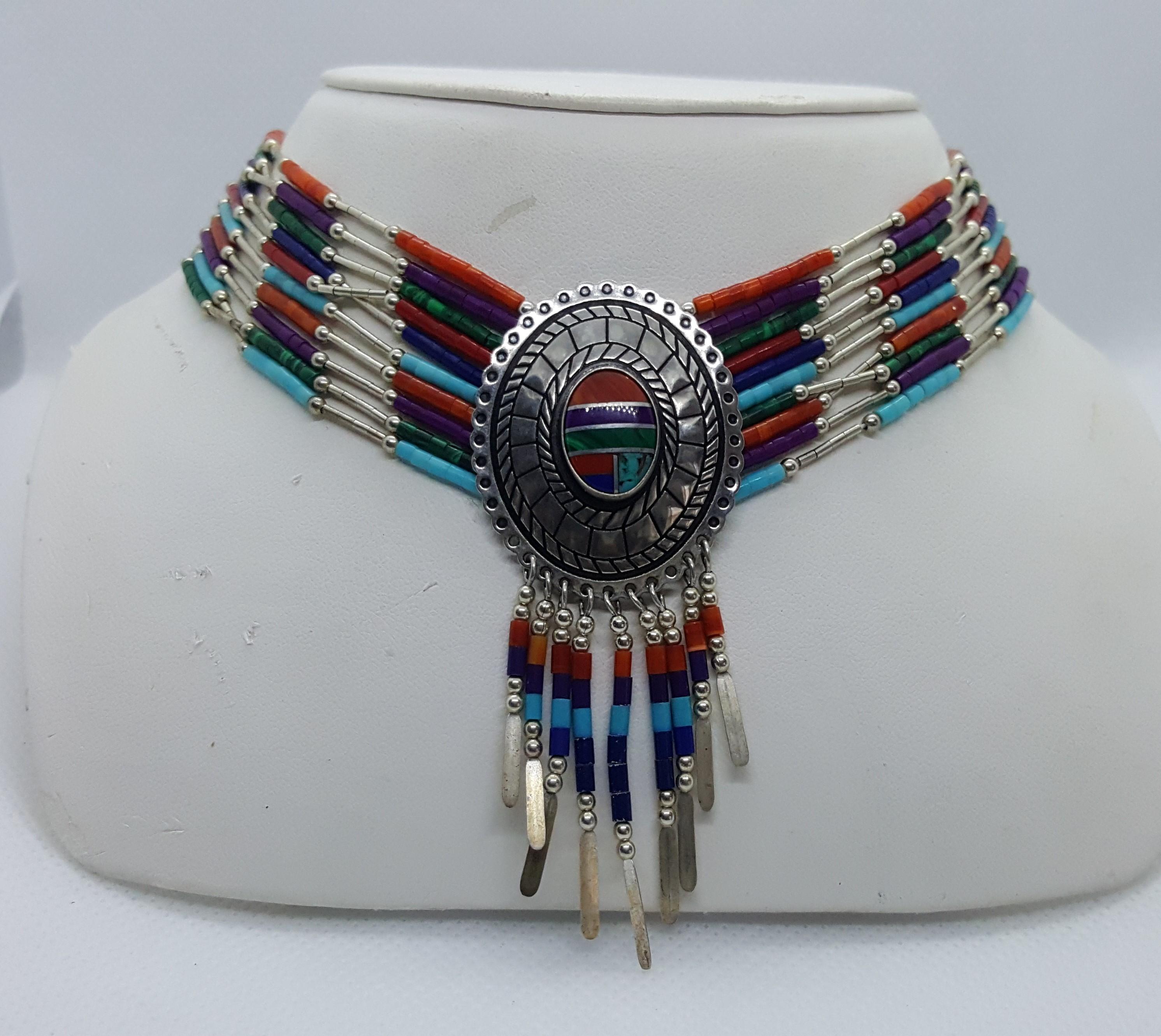 American Southwestern Jewelry Set with Dangle Earrings and Dangle Necklace with Pendant. This set weighs 50 grams and the necklace is 18 inches long. The earrings are 30mm by 35 mm in diameter. Multi-stone inlay. Made by Quoc Turquoise in