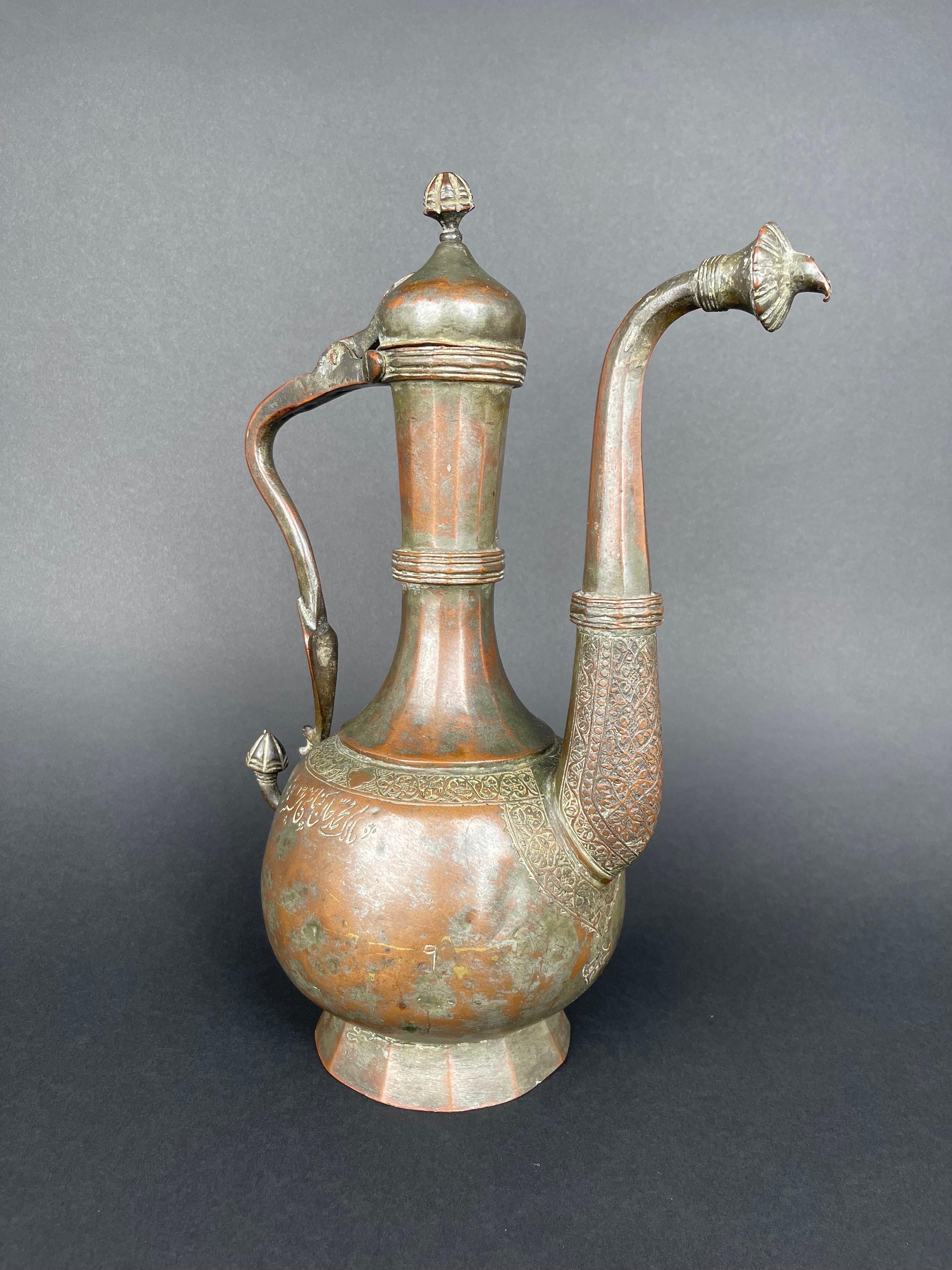 Qajar Dynasty Tinned Copper Hand Hammered Chiseled Ewer, 

Iran, 19th Century 

Signed and Dated 1269