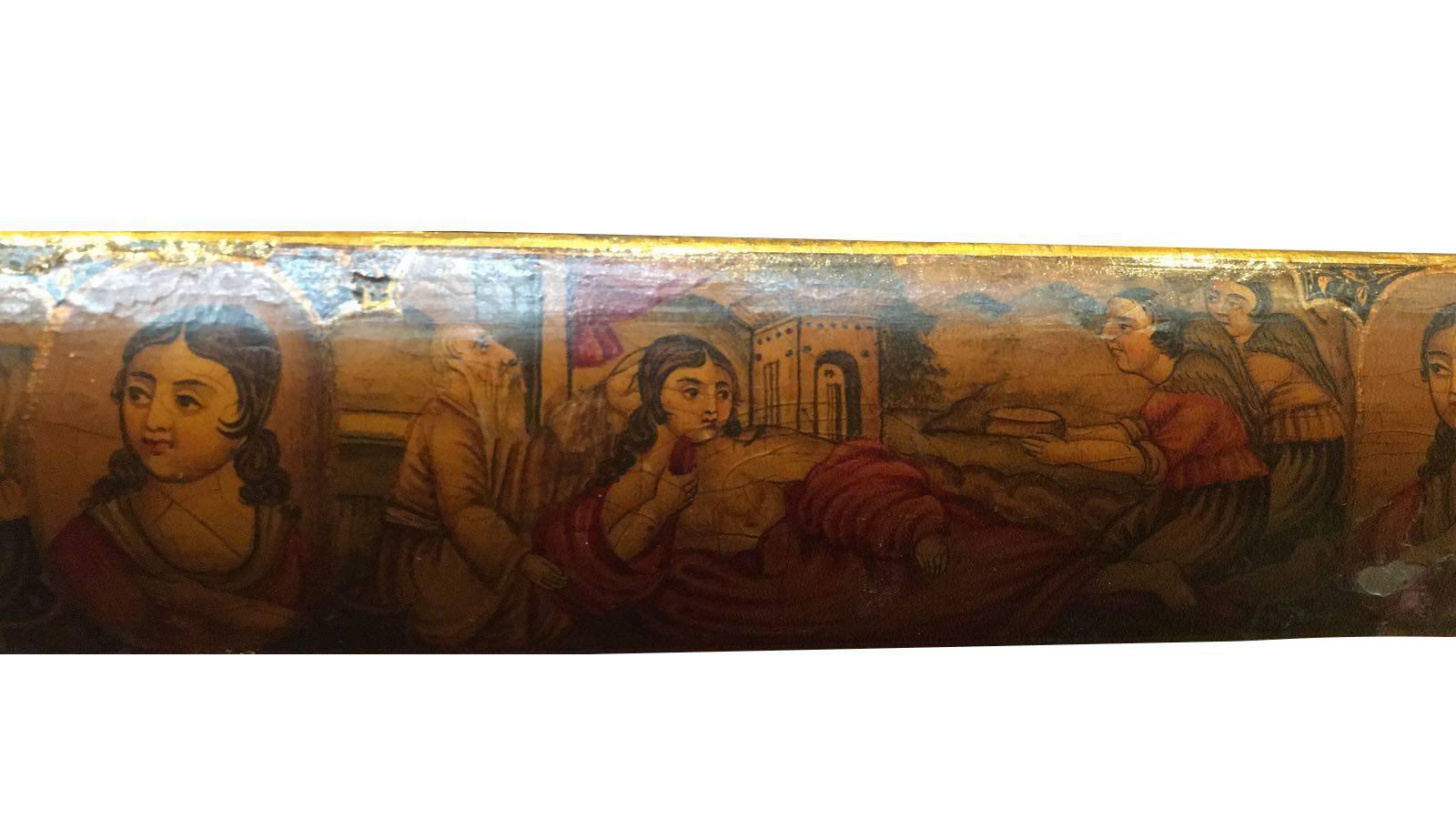 A Qajar paper mache Royal pen-box.

Measures: H 4cm x 22.5cm.