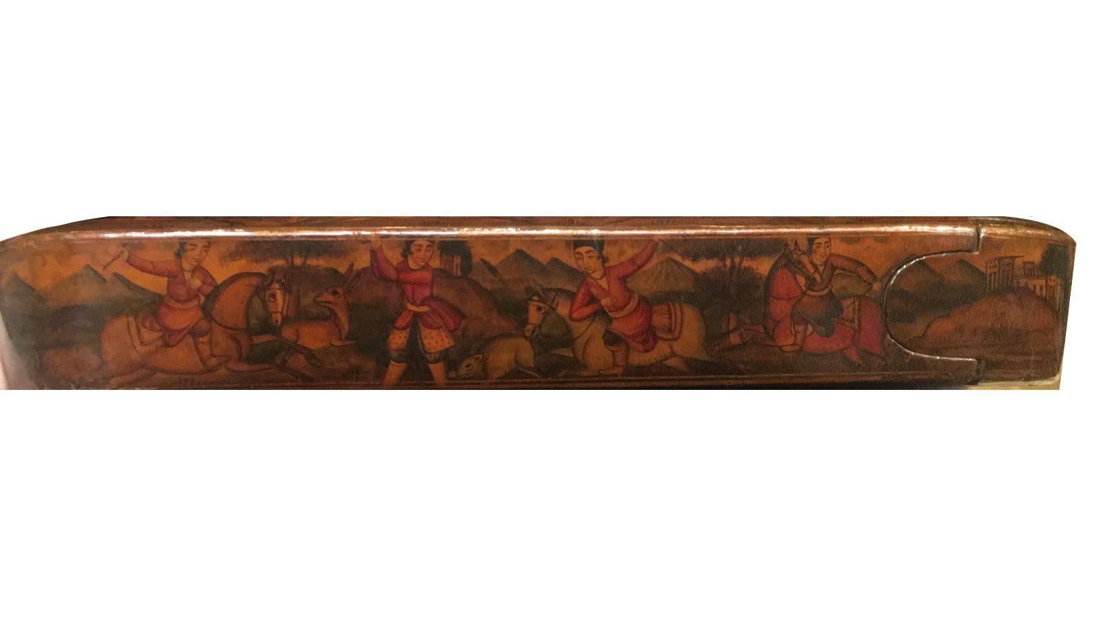 Qajar paper mache Royal pen-box

Measures: H 4cm x 22.5cm.
