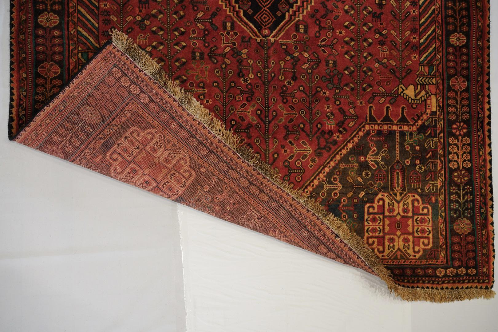Another in our limited collection of superior woven and highly finished tribal pieces from the early 20th century . This example projects the authentic Qashgai symbols of tribal medallions, and flowers along with some artistic touches which belong