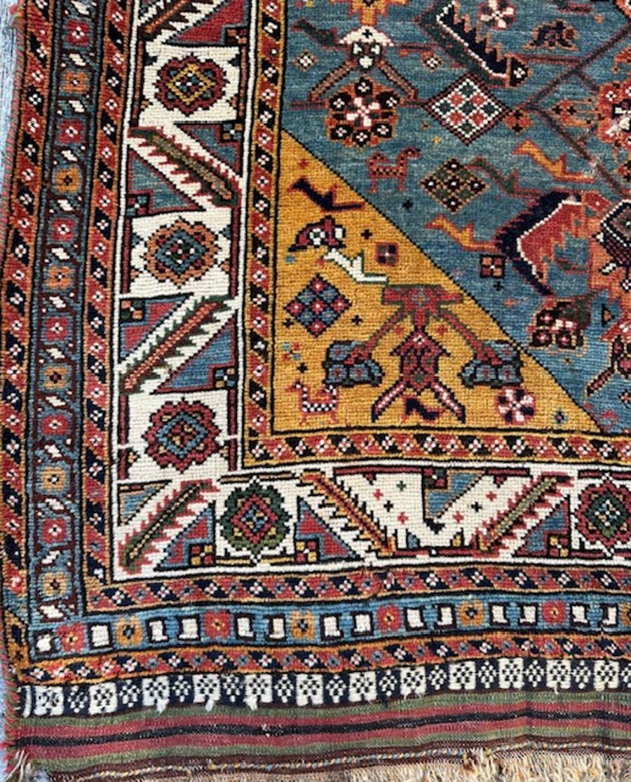 Qashqai rug from south west Persia (Iran)

Age: circa 1875

Size: 6′.7″x3′.3″ (201×99 cm)

This unusually formatted south west Persian dozar scatter rug shows a medium blue ground supporting an offset three column Herati design of open