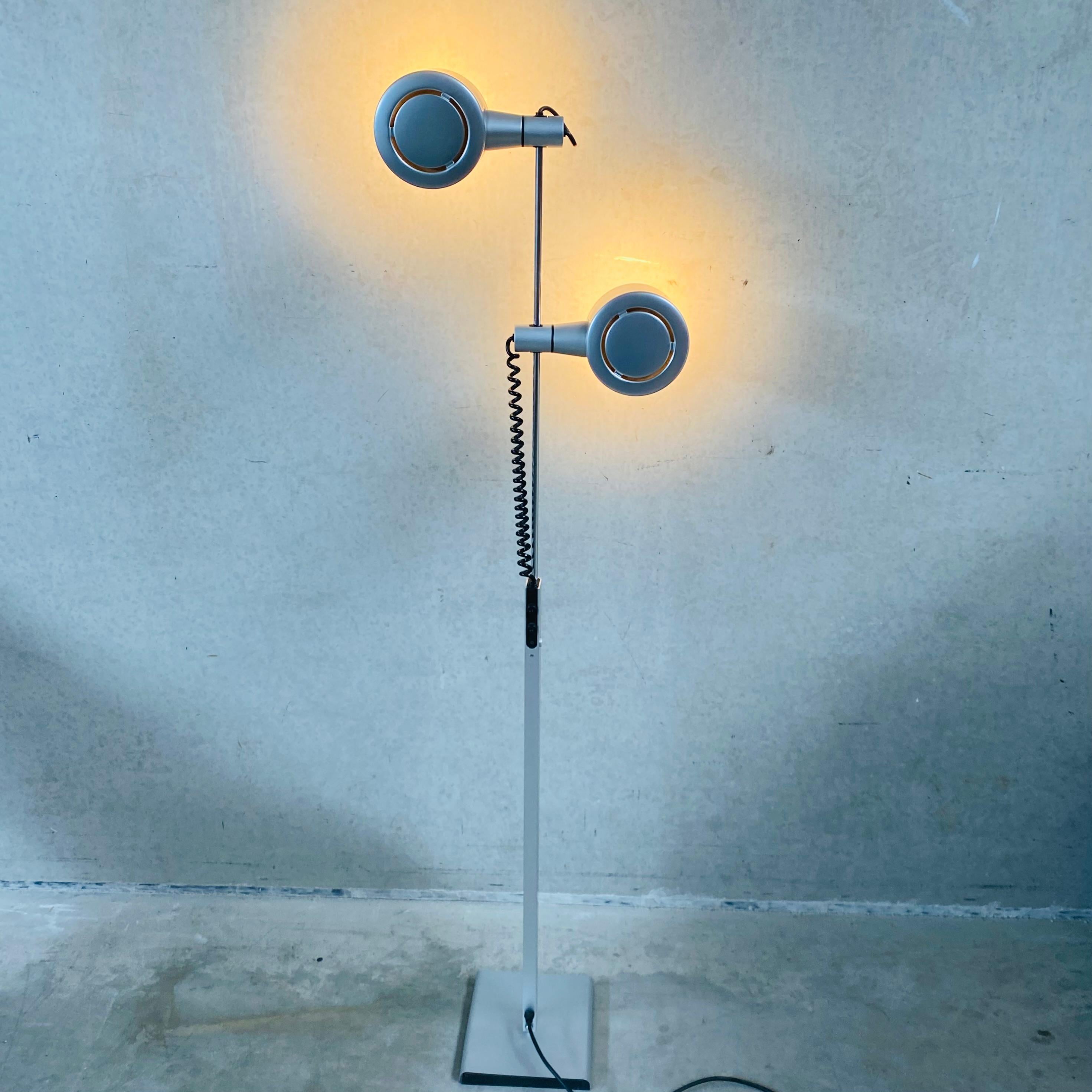 Introducing the QC twin spotlight floor lamp by Ronald Homes, a true icon of 1970s design now available through ConeLight Limited in the UK. With its sleek and minimalist silhouette, this lamp is the perfect addition to any modern