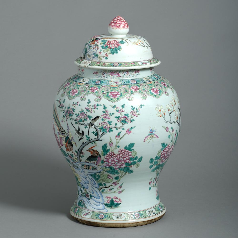 A large Qianlong famille-rose vase and cover painted with peony and pheasants, magnolia, butterflies and magpies, late 18th century.