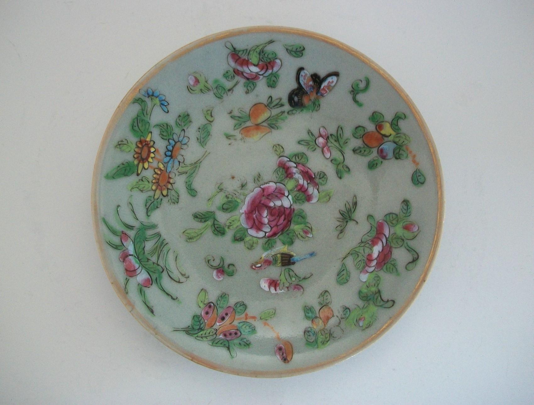 Antique Qing dynasty Chinese export celadon 'famille rose' porcelain plate - featuring hand painted enamels of flowers, butterflies and birds - gilded border edge - underglaze blue square seal mark to the base - China - circa 1820.

Excellent